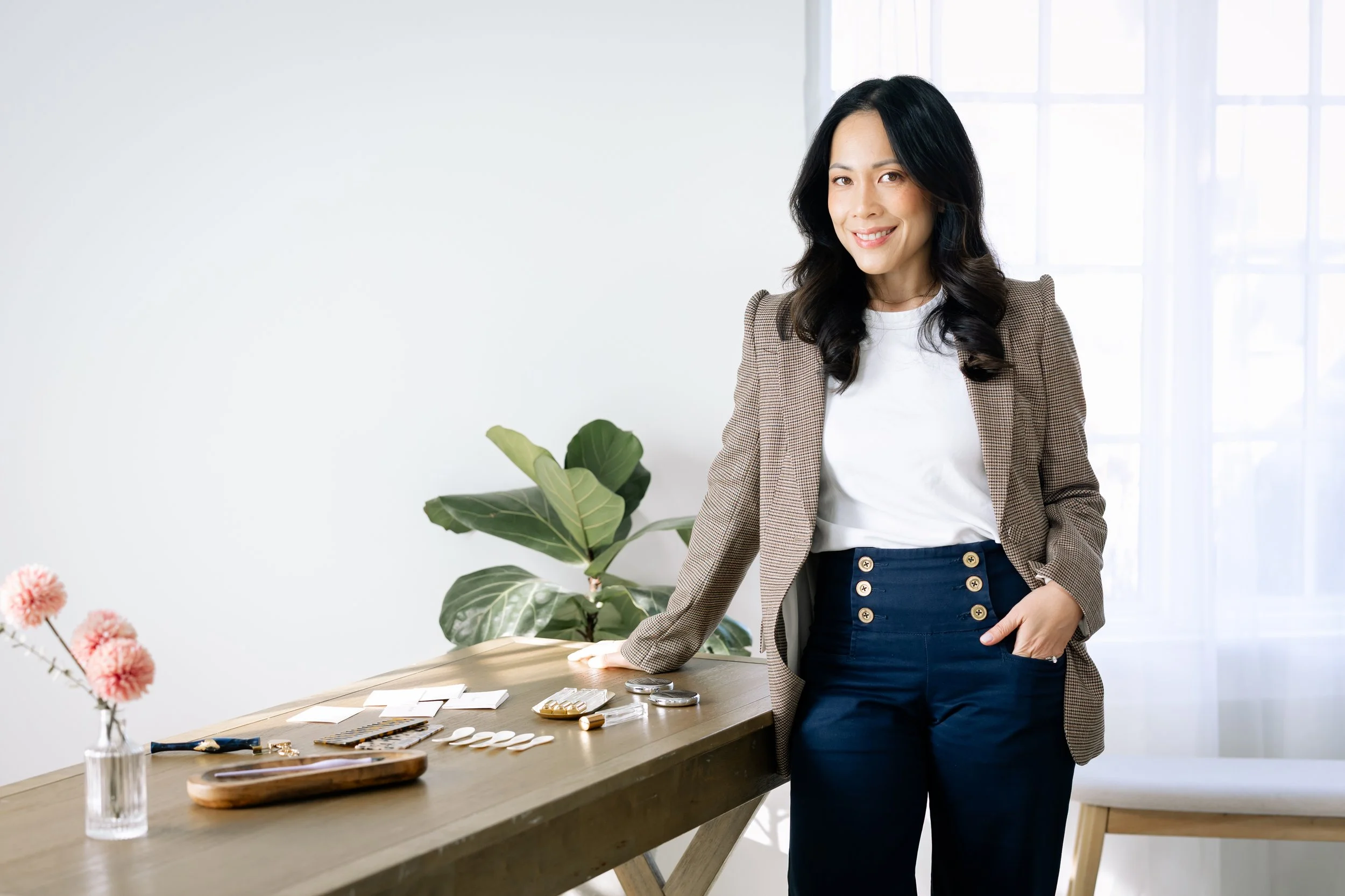 Kaity Kwock, New Jersey–based calligrapher and engraver in her studio, creating custom calligraphy, engraving, and personalized gifts.