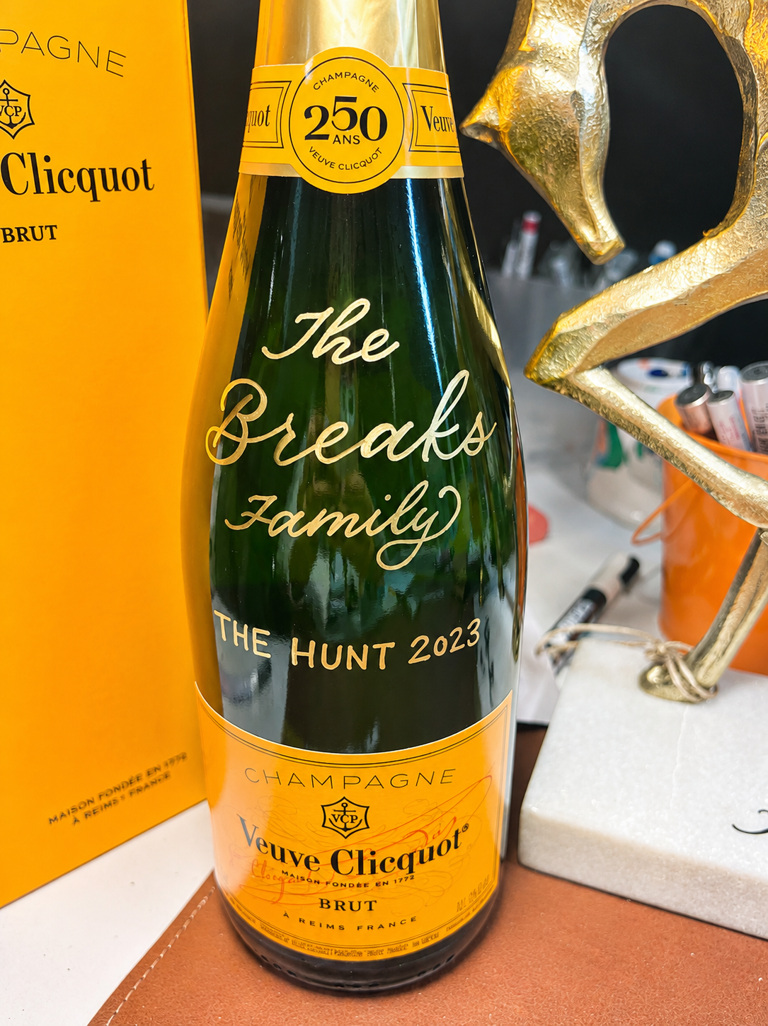 Live calligraphy on Veuve Clicquot champagne bottle — personalized bottle calligraphy for luxury events and weddings by KWK Creative Studio, NYC and New Jersey