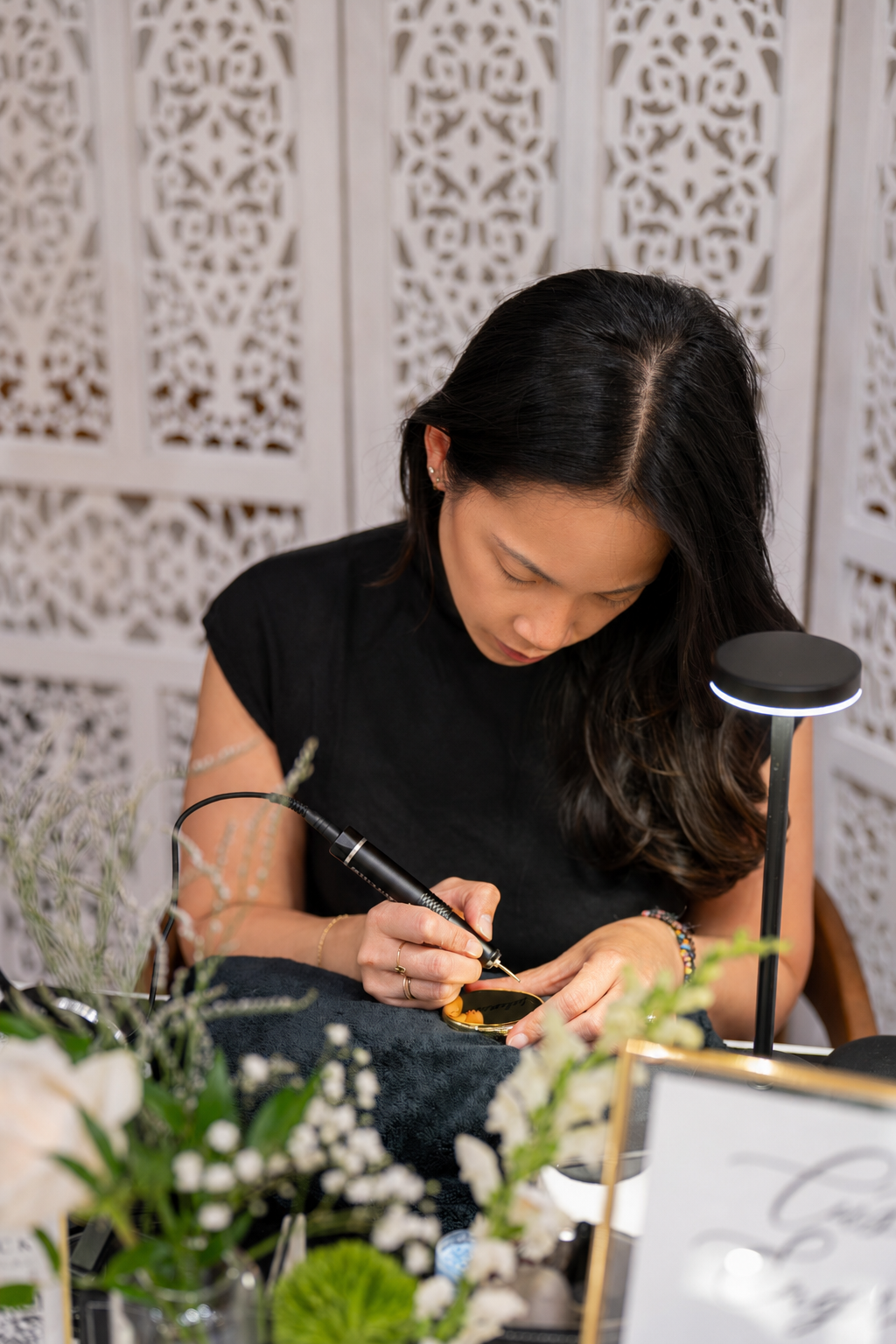 Kaity Kwock of KWK Creative Studio live engraving at a bridal shower in New York — professional calligrapher available for weddings and brand activations in NYC and New Jersey