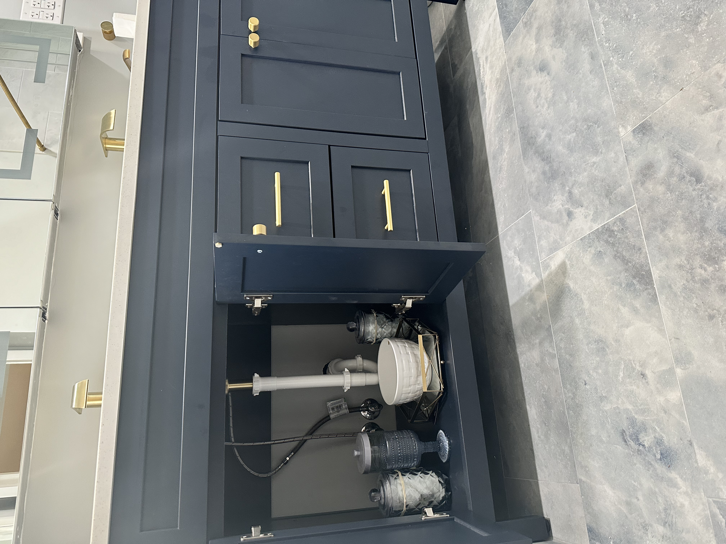 This vanity had plenty of room underneath and the customer was so excited to use their new bathroom they already began placing new items. Can you blame them?