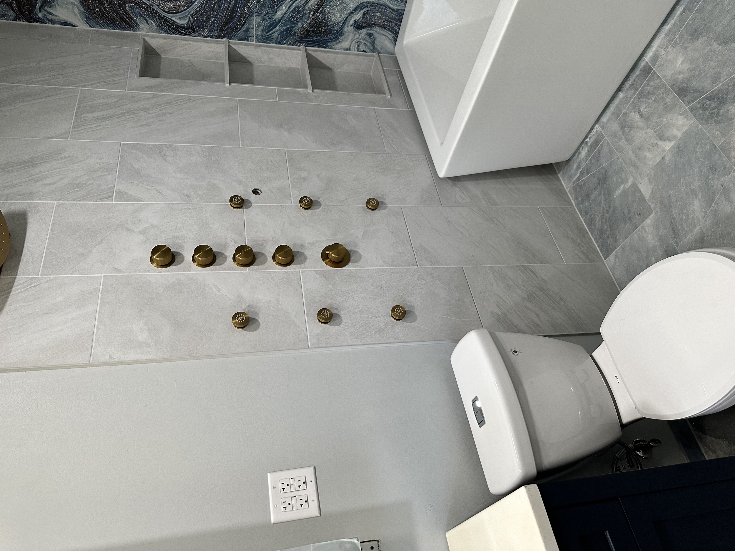 Soaking tub and toilet in, time for the sliding soft-close shower door.