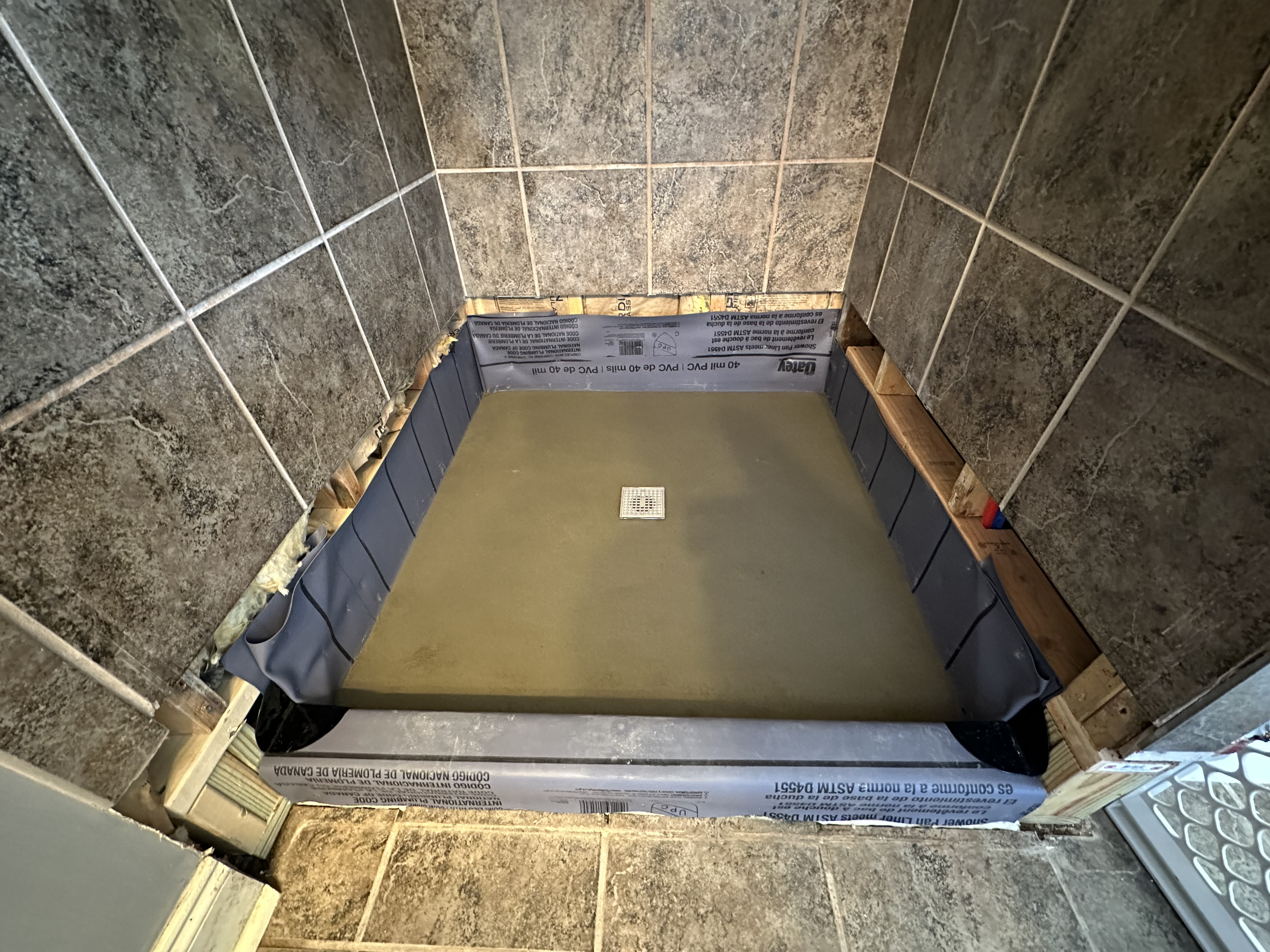 Dry pack mud bed installed and ready for tile.