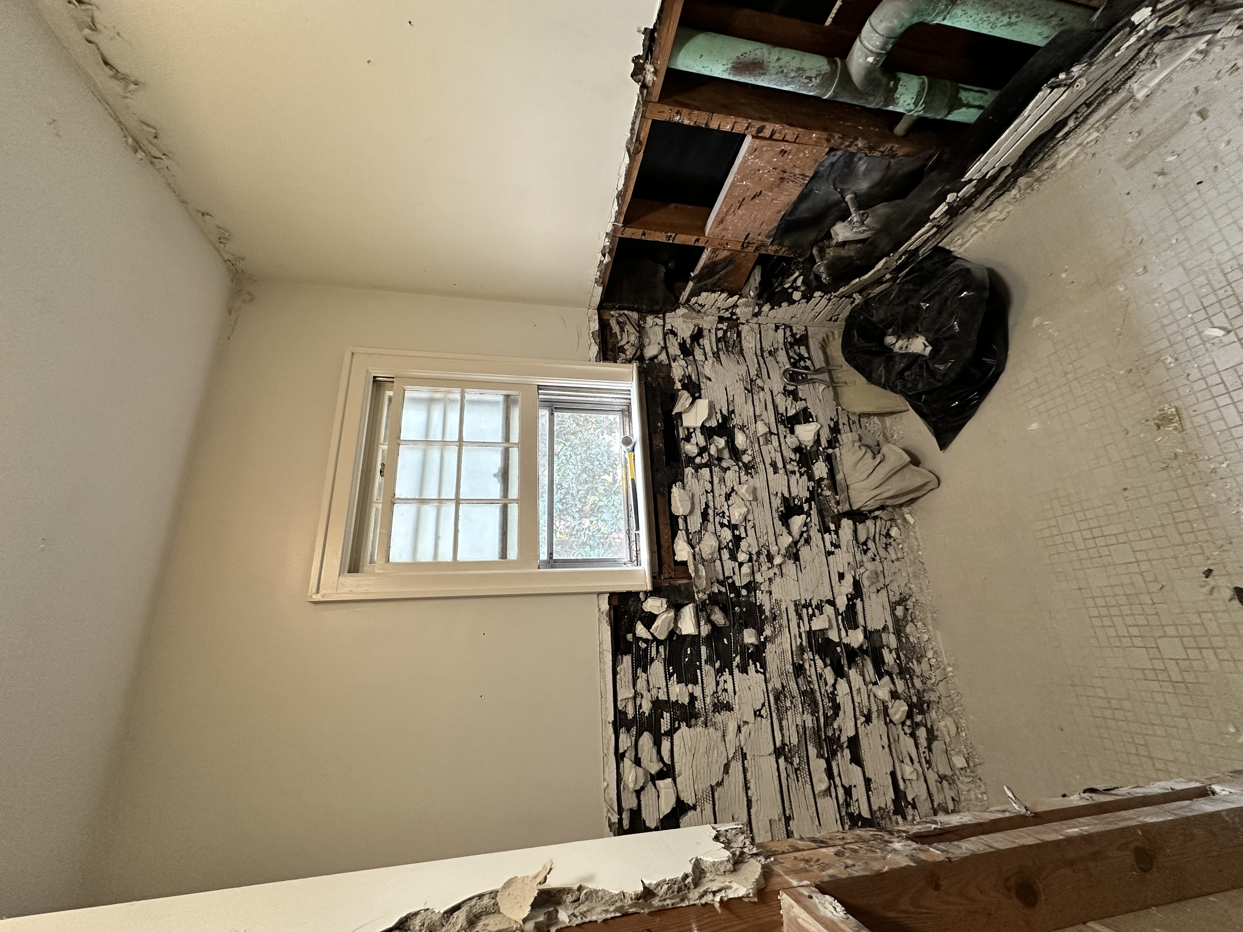 All of the tile on the walls were installed the same way, it took a lot of elbow grease to get these tile removed.