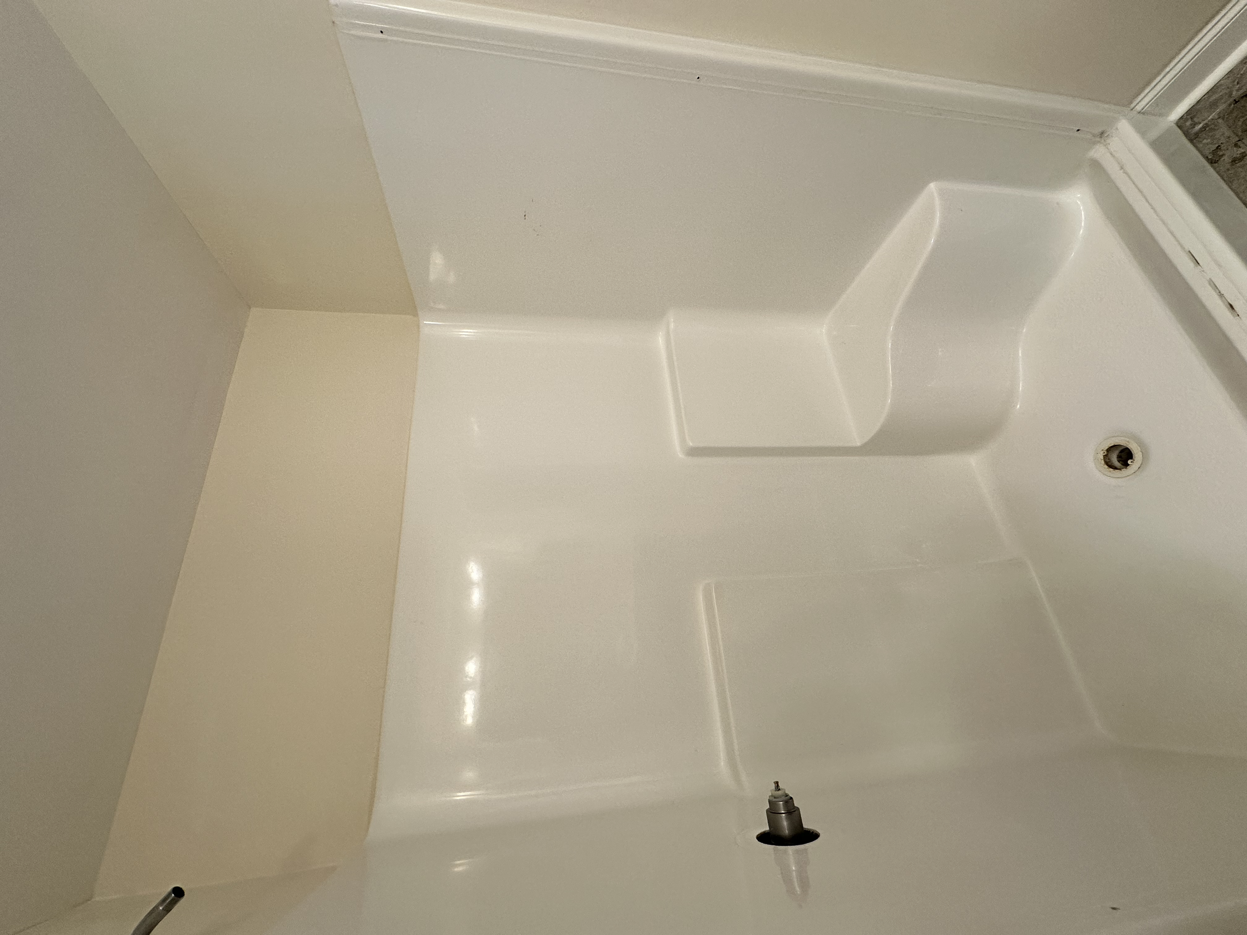 A lot of customers are tearing out the old fiberglass inserts. After a while, the stains are hard to clean off the surface of these showers.