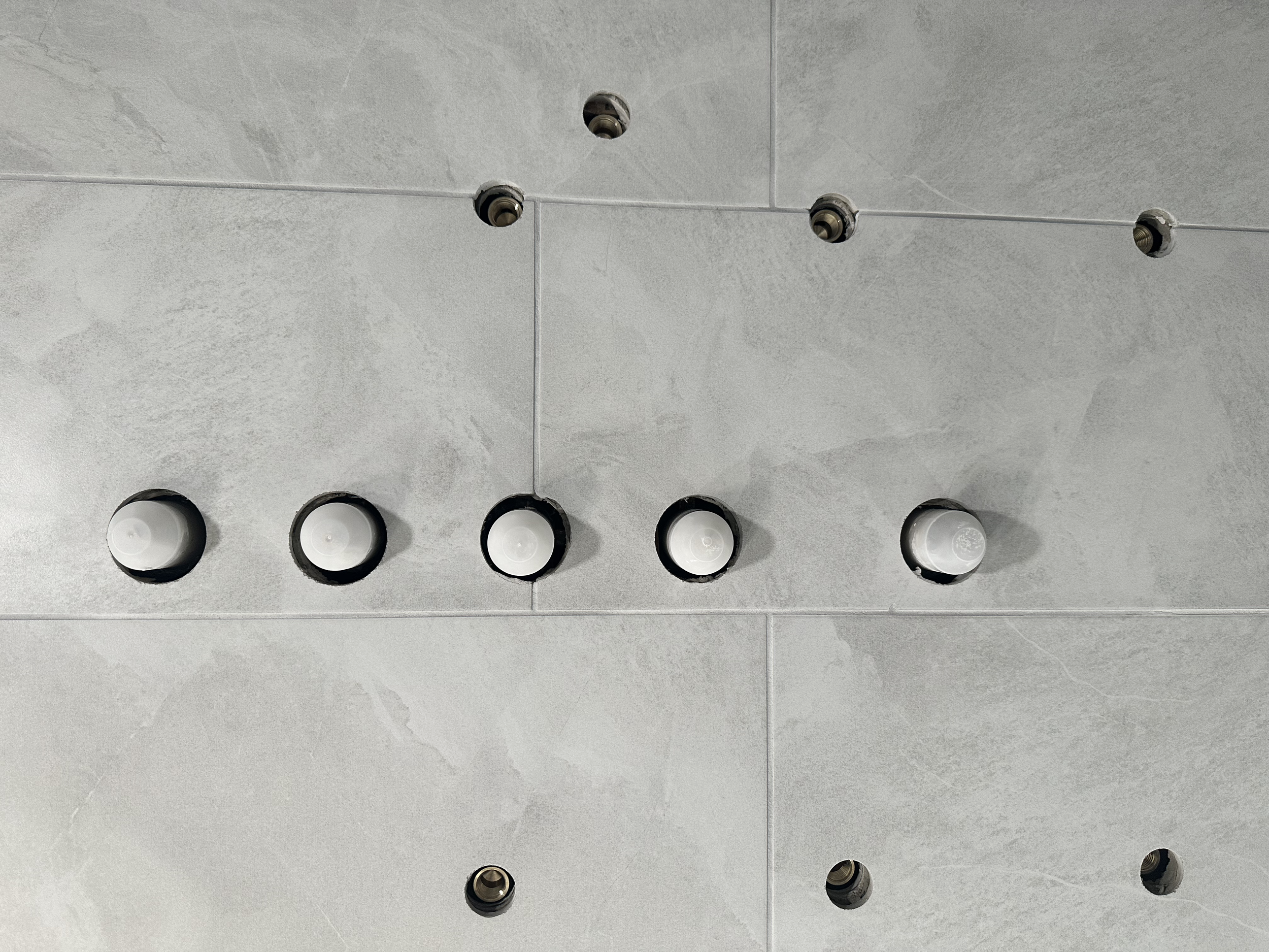 This shower system has six jets, a handheld sprayer, and a rain shower head.