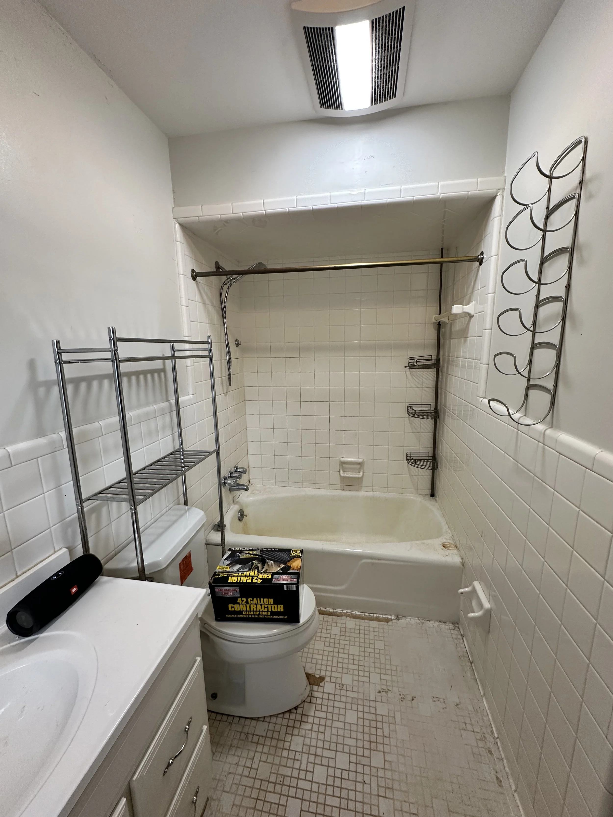 This home was built in the 1950's. Here you can see the original tiles for the shower and floor.