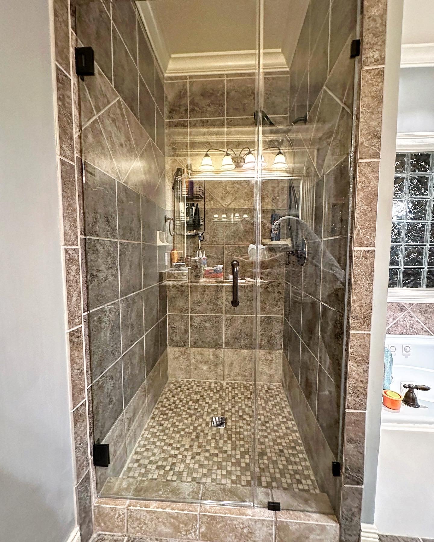 New frameless shower door installed, now our customer won't have to worry about endlessly cleaning a shower door frame.