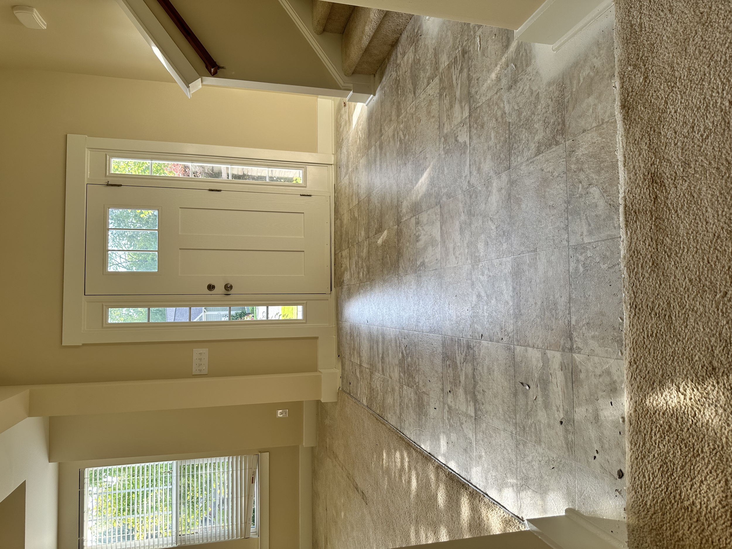 This linoleum flooring in the foyer had to go