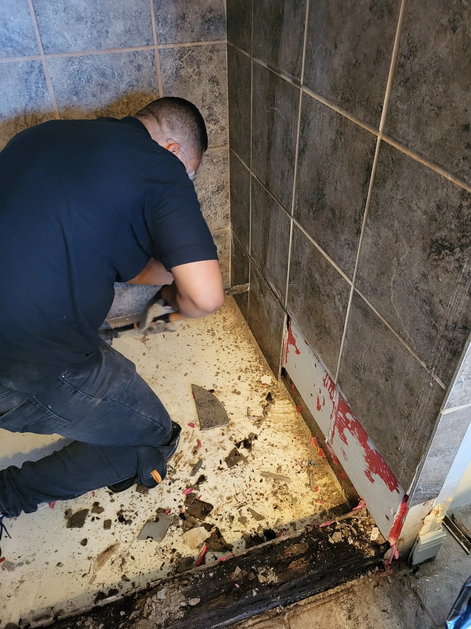 We removed the last row of tile in order to properly install the new shower pan liner for our new shower pan.