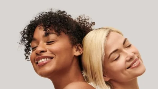 Two women with healthy skin representing medical-grade aesthetic treatments in Ottawa