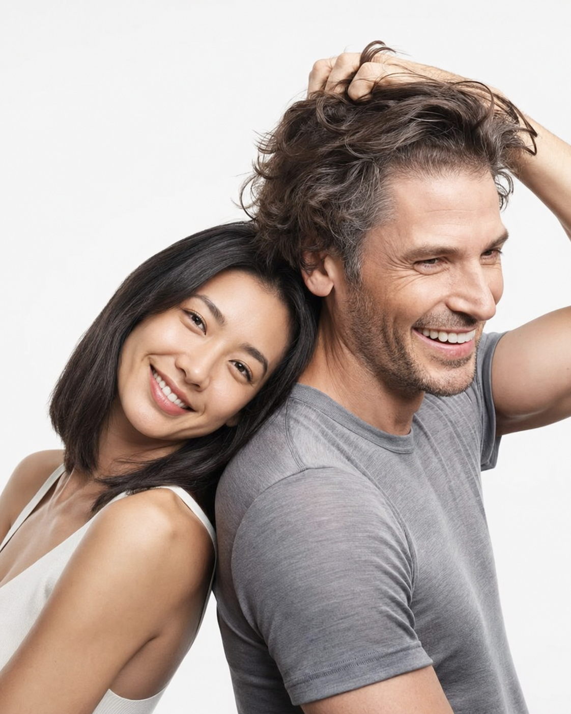 Man and woman smiling, representing Apex Hair Restoration & Aesthetics' Ottawa hair clinic.