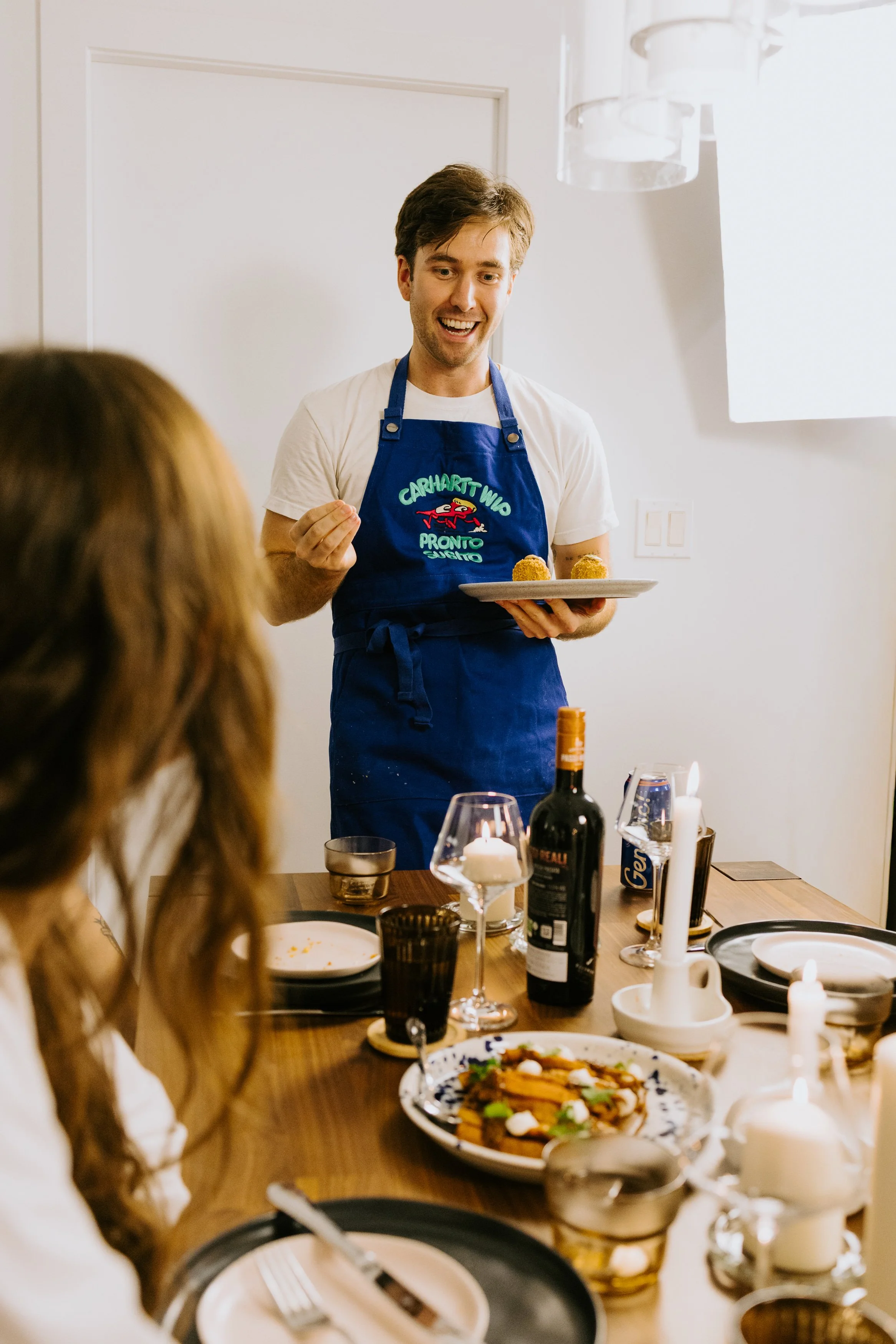 Winnipeg private chef serving fine dining dish from menu to clients