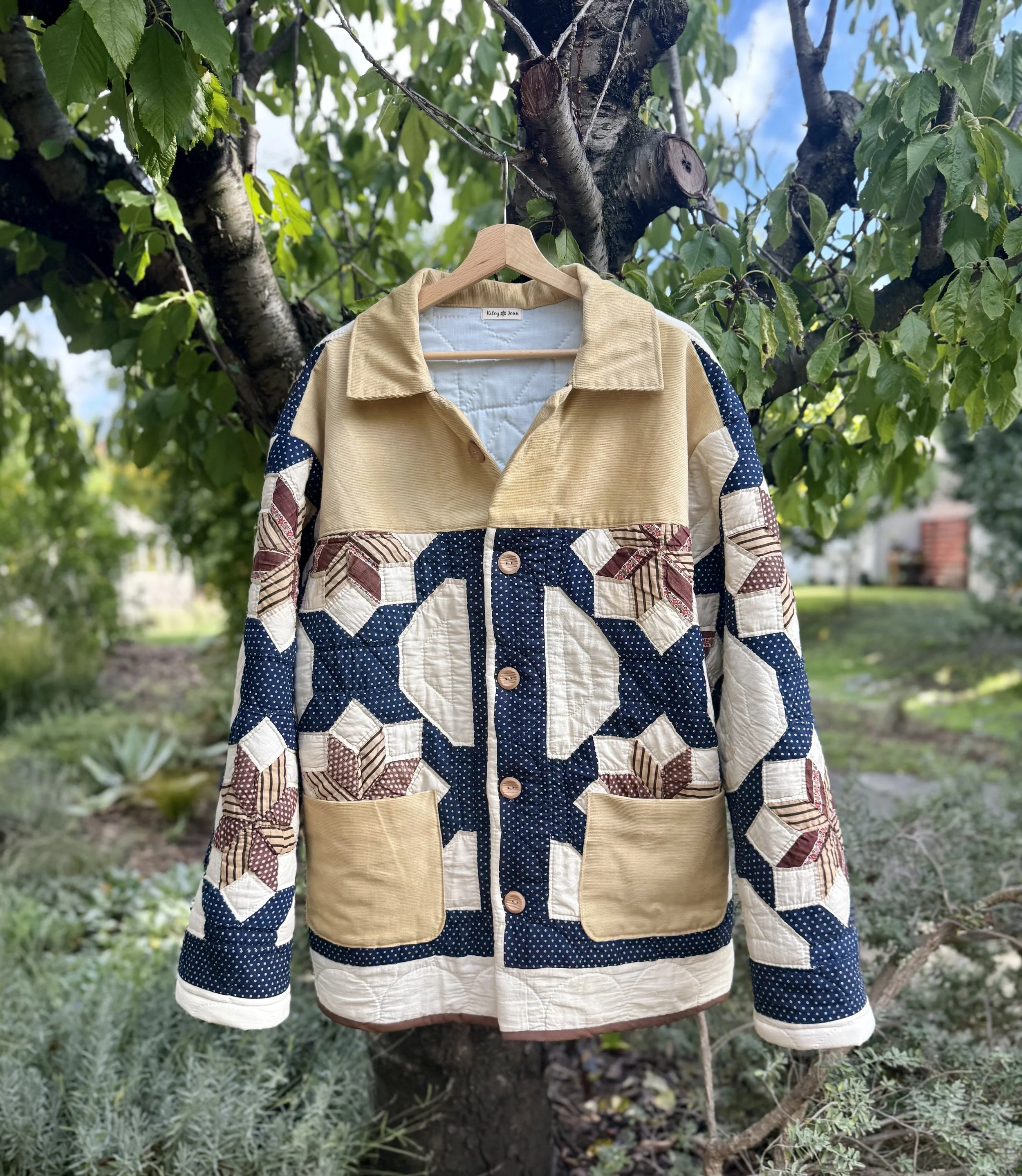 Ranch Coat: this coat is a male/unisex design, straight fit and broader shoulders with snap or button closures.