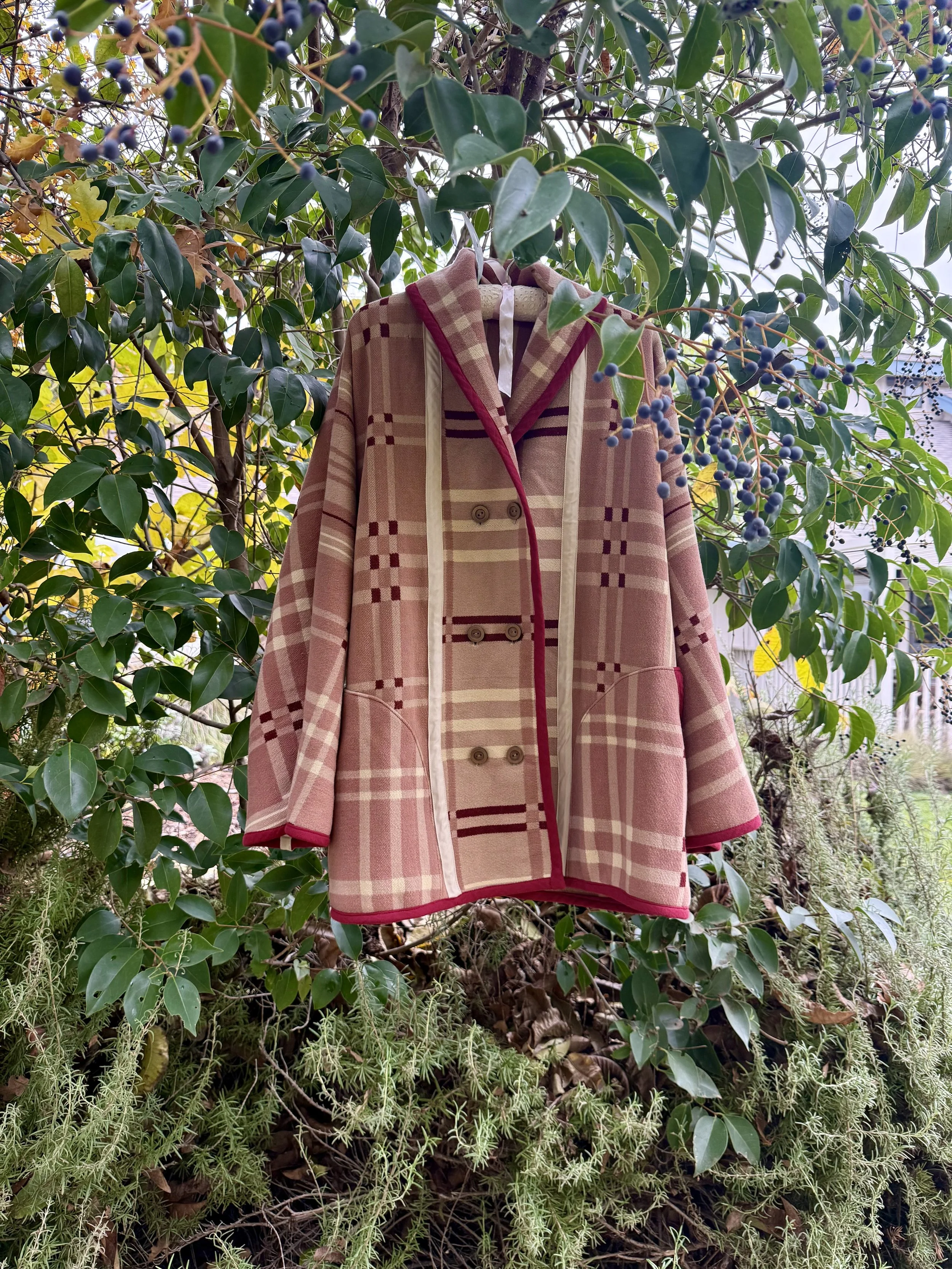 Camp Coat: this coat is oversized with deep pockets and big lapels that overlap with double breasted snap or button or a single column of toggles closures.