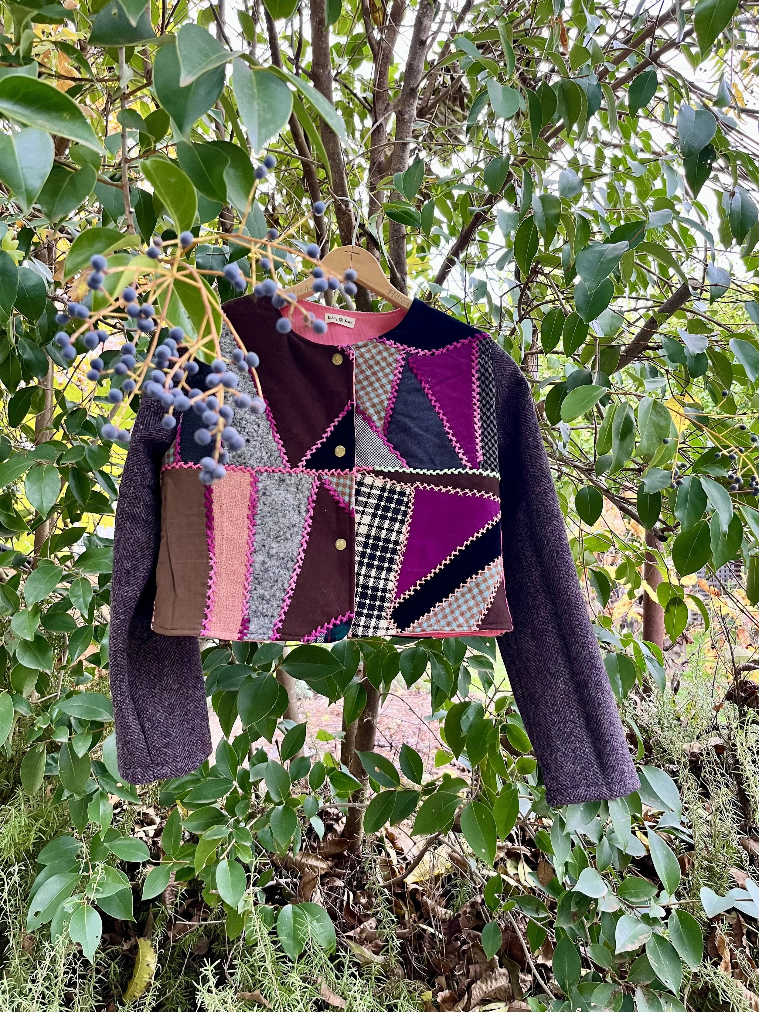 Field Coat: this coat has a fitted, cropped silhouette and a secret pocket in the lining with snap, button or toggle closures.