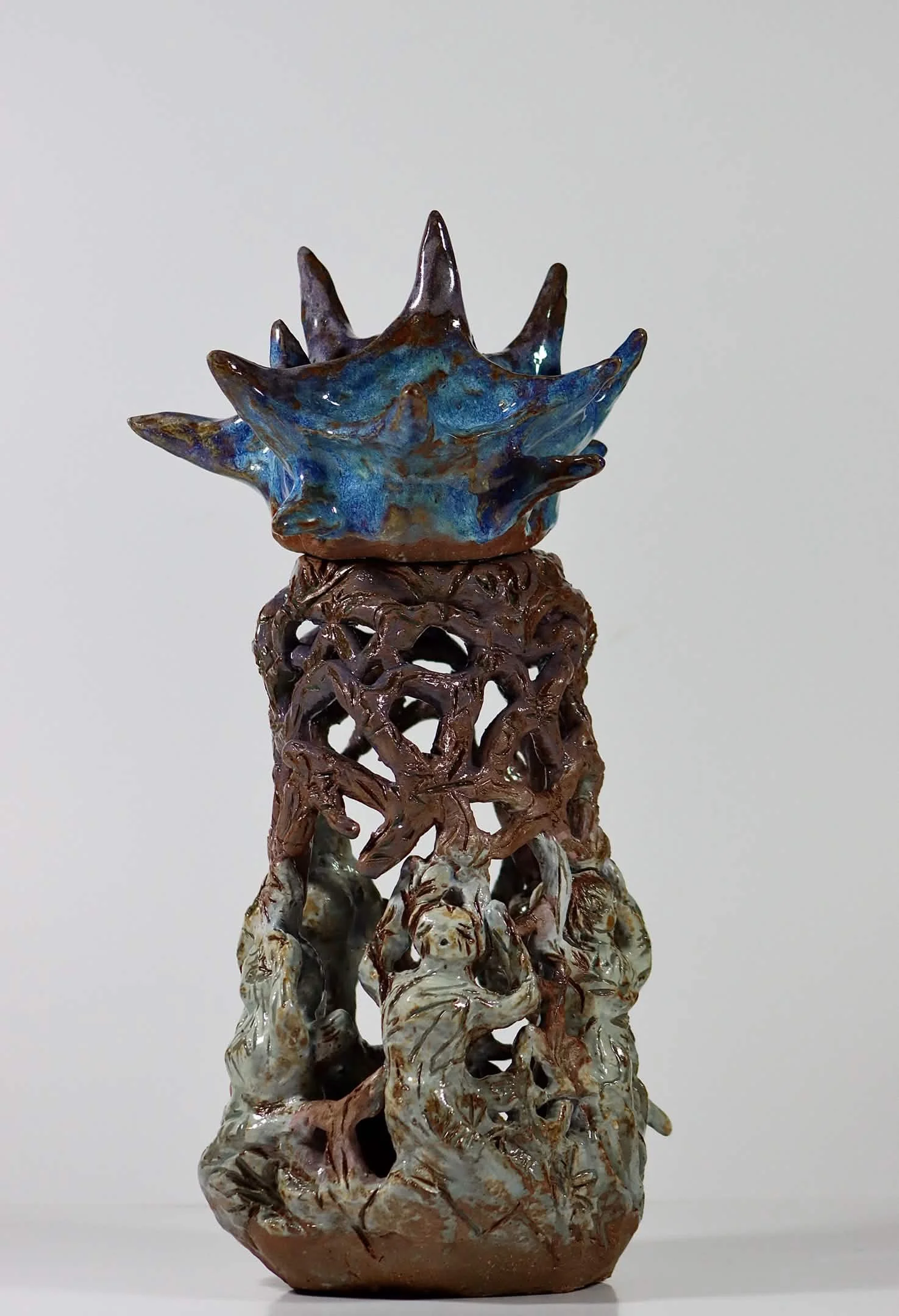 “Weight on your shoulders”, 2025.
Red stoneware clay with sgraffito and purple slip, celadon, purple haze, and cerulean blue heaven glazes.
3" x 11" inches. 
The heavy and hard expectations being weighed on upon your shoulders while holding on to you