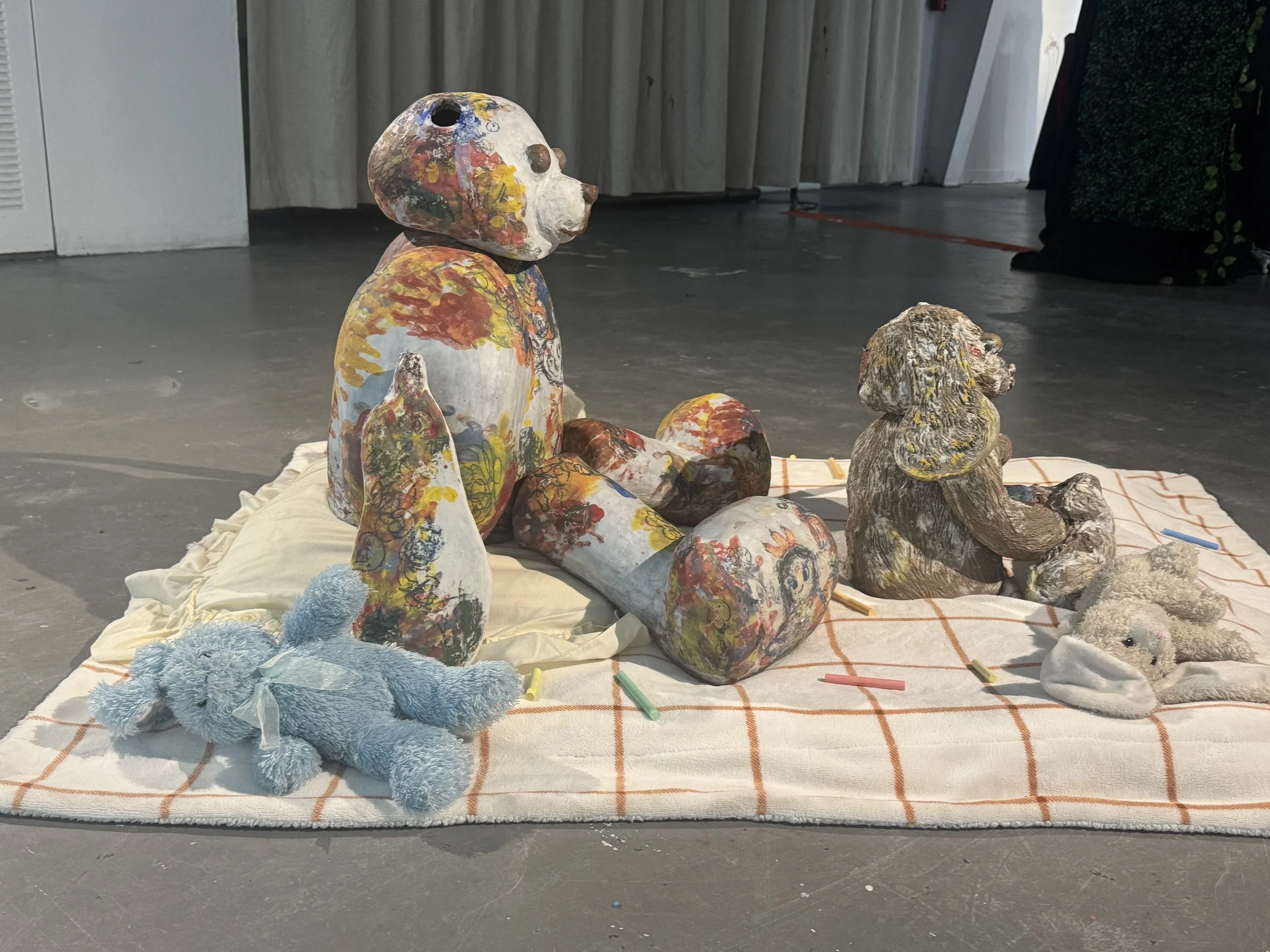 "Repatching My Inner Childhood", 2025. 

Red stoneware clay, Porcelain slip, Underglaze paint and crayons.
22" x 24" and 14" x 8".                                                                
Preserving my precious childhood memories by repatching