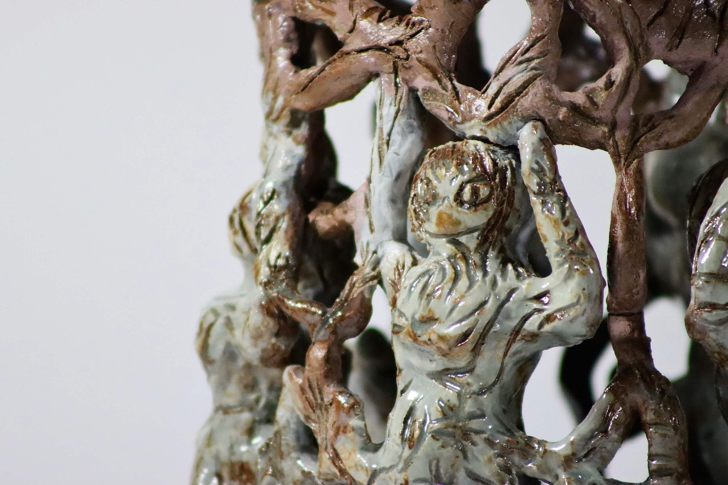“Weight on your shoulders”, 2025.
Red stoneware clay with sgraffito and purple slip, celadon, purple haze, and cerulean blue heaven glazes.
3" x 11" inches. 
The heavy and hard expectations being weighed on upon your shoulders while holding on to you