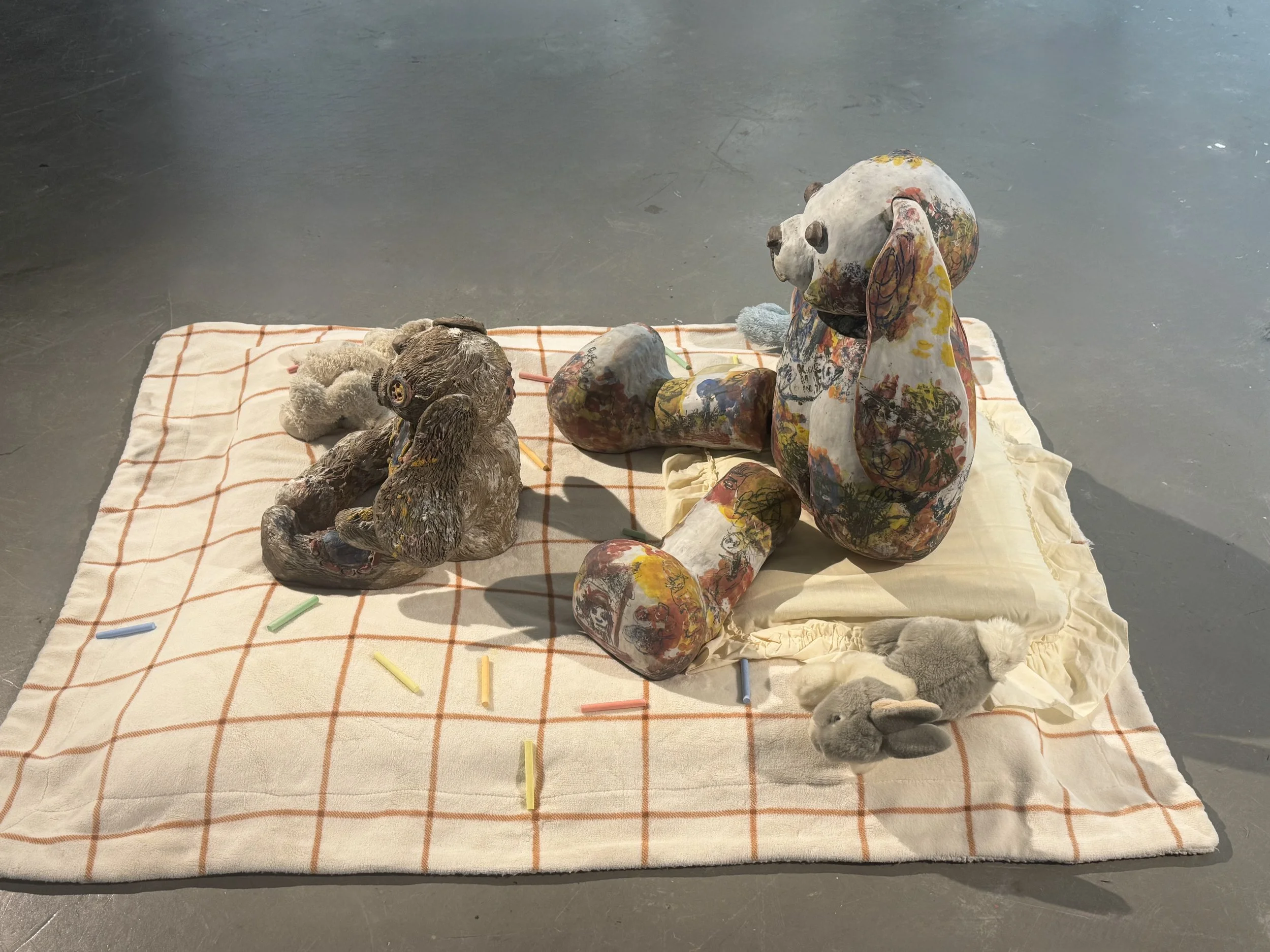 "Repatching My Inner Childhood", 2025. 

Red stoneware clay, Porcelain slip, Underglaze paint and crayons.
22" x 24" and 14" x 8".                                                                
Preserving my precious childhood memories by repatching