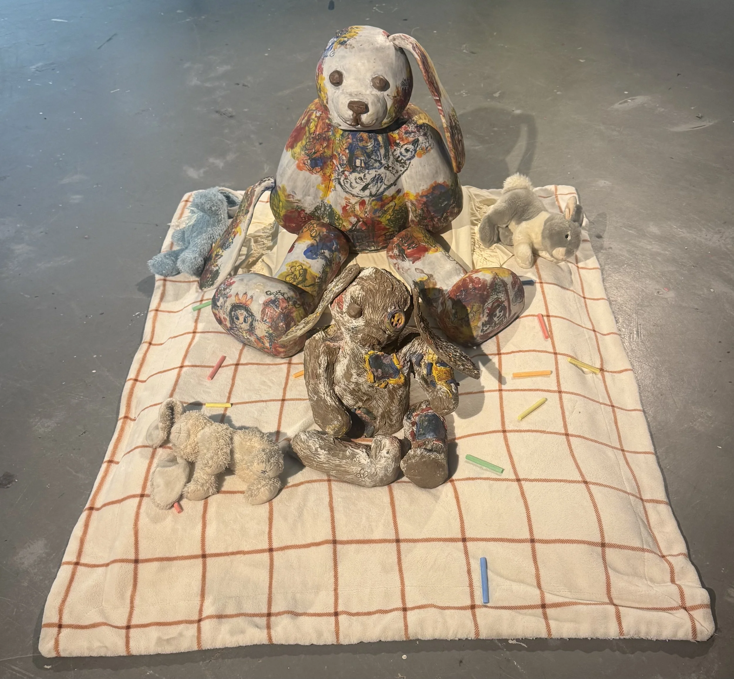 "Repatching My Inner Childhood", 2025. 

Red stoneware clay, Porcelain slip, Underglaze paint and crayons.
22" x 24" and 14" x 8".                                                                
Preserving my precious childhood memories by repatching