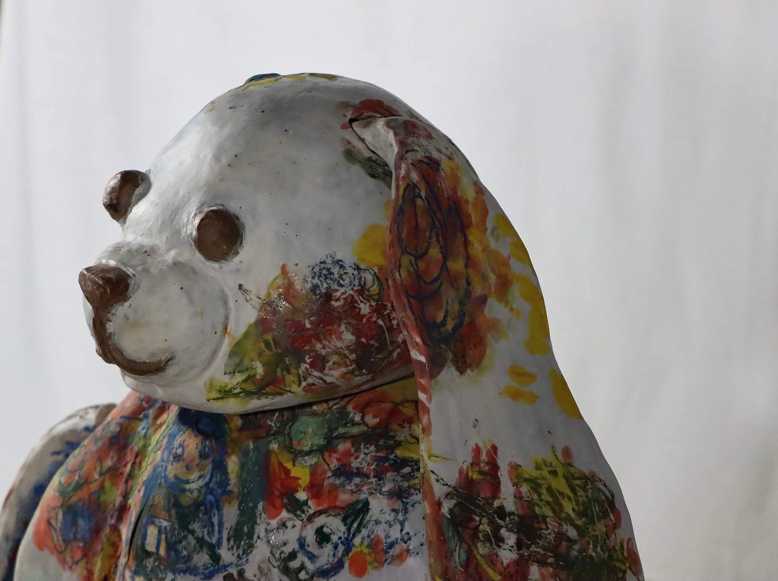 "Repatching My Inner Childhood", 2025. 

Red stoneware clay, Porcelain slip, Underglaze paint and crayons.
22" x 24" and 14" x 8".                                                                
Preserving my precious childhood memories by repatching