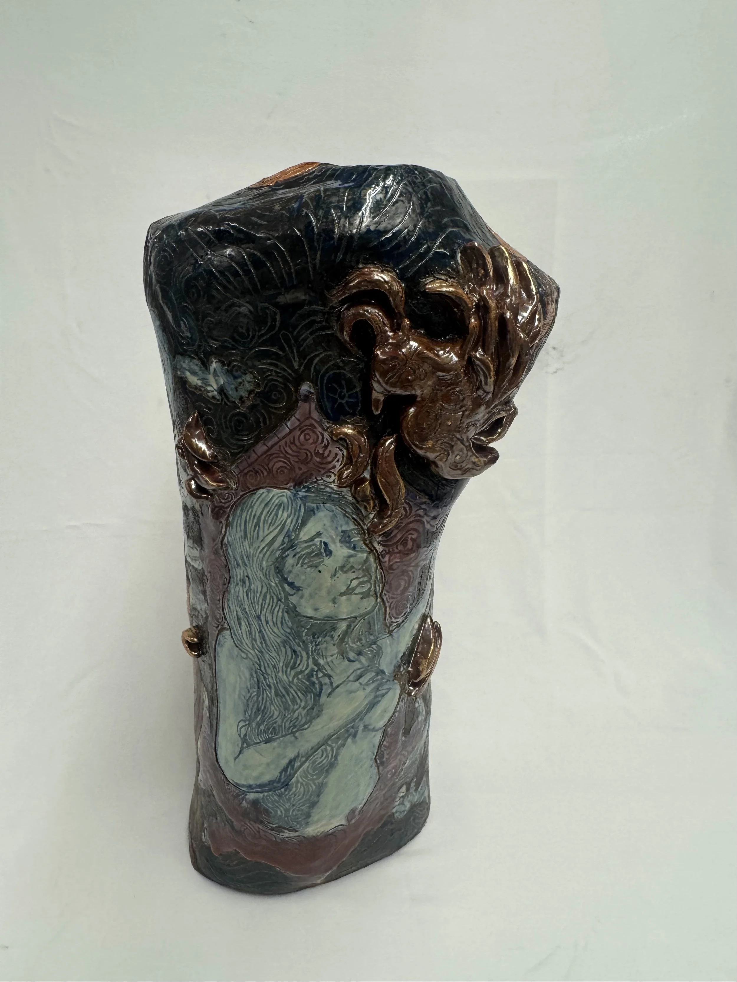 “Reborn Again”, 2025. Red stoneware clay with sgraffitto,  black and porcelain slips, malcolm shino, red irwing, peach bloom 2, cuba's beaches, purple haze, and gold acrylic paint.
9" x 23" inches 