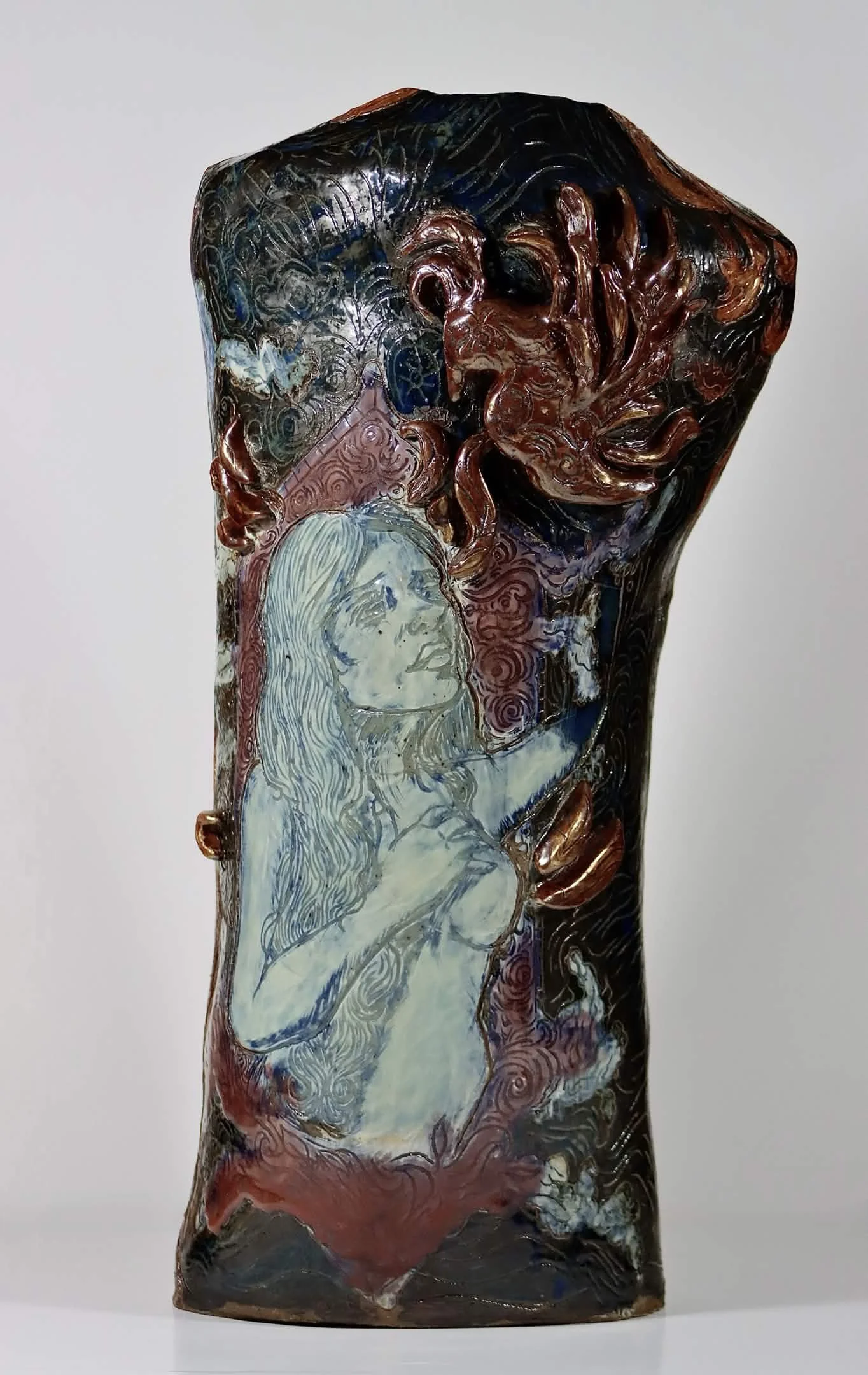 “Rebirth”, 2025. Red stoneware clay with sgraffitto,  black and porcelain slips, malcolm shino, red irwing, peach bloom 2, cuba's beaches, purple haze, and gold acrylic paint.
9" x 23" inches. 
The ceramic vase displays a narrative story of rising fr