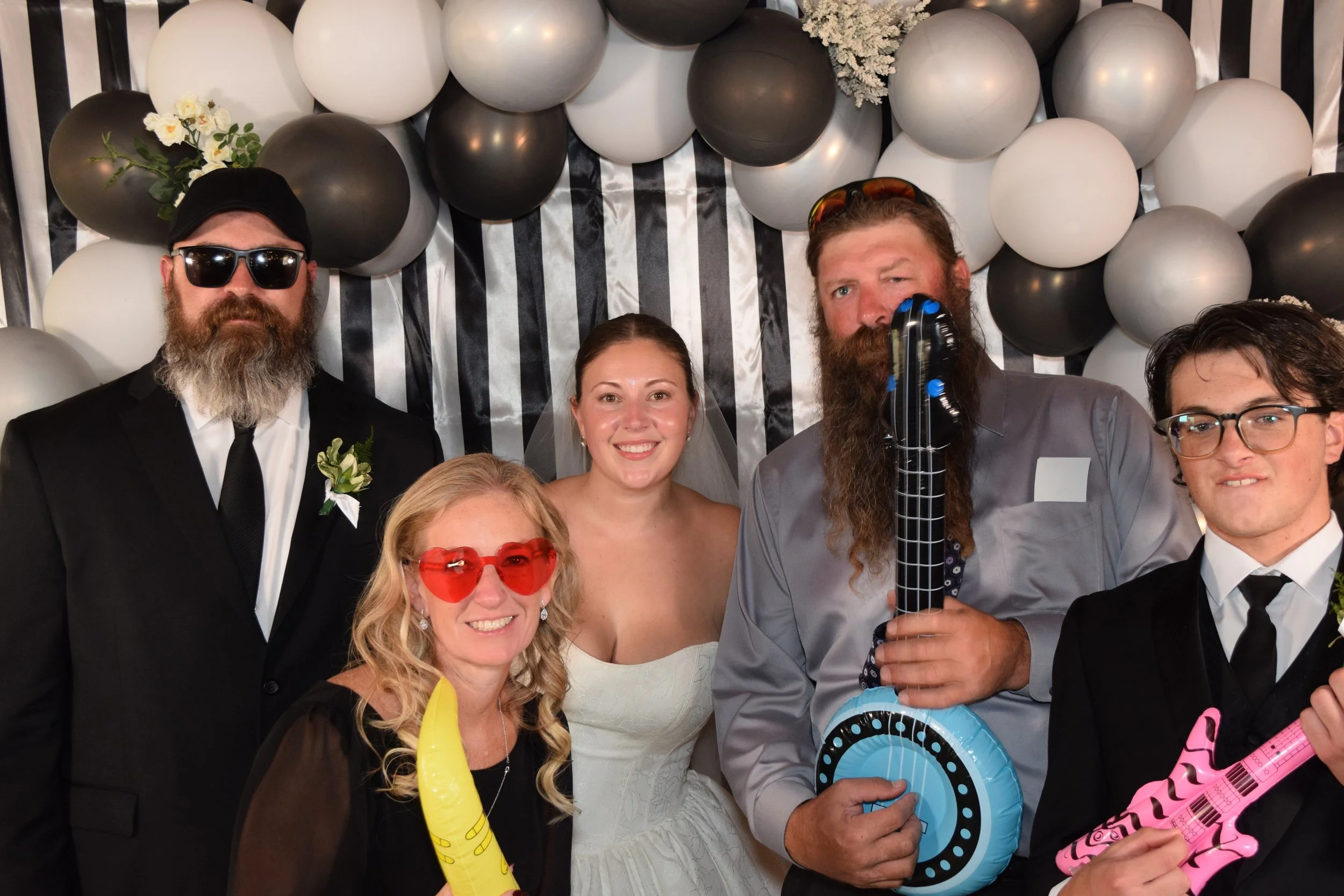 People in front of a photobooth backdrop.