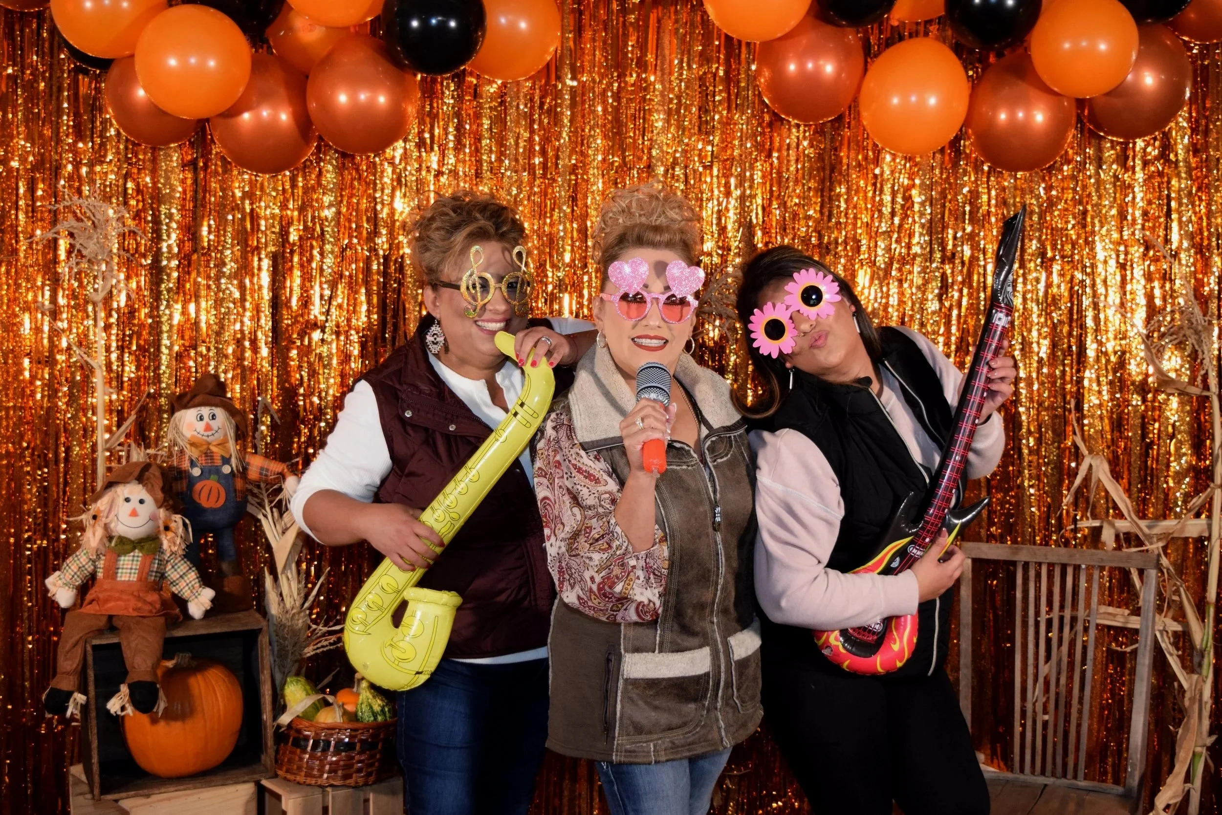 People in front of a photobooth backdrop.