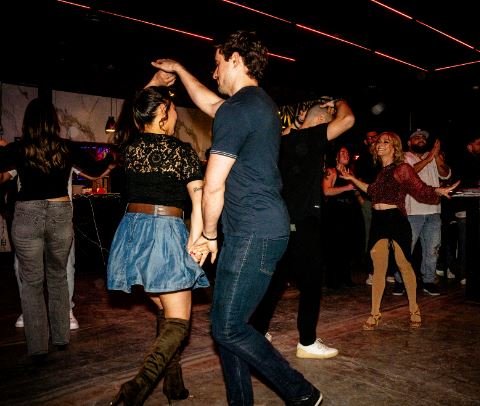 Geometric drawing of an outline square with sections divided by vertical, horizontal, and half circle lines.