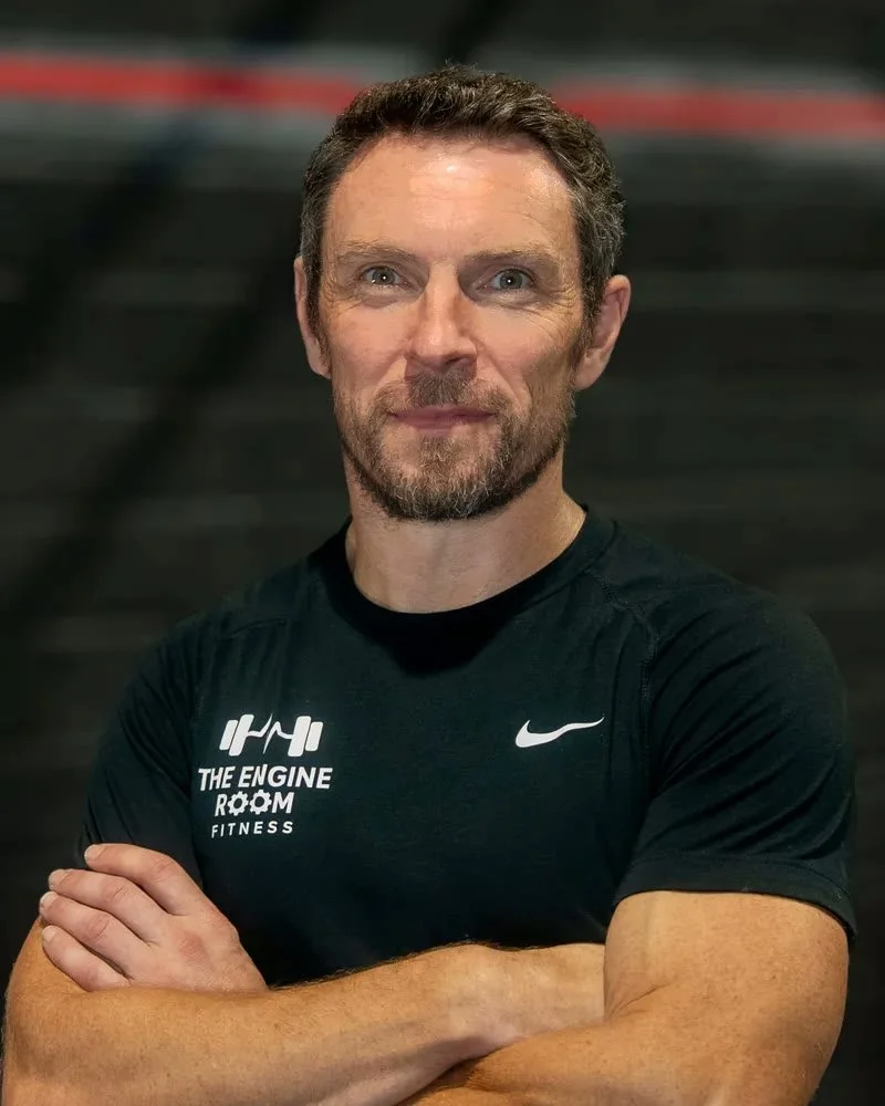 Eoin Byrne, co-founder and coach at The Engine Room Fitness, arms folded