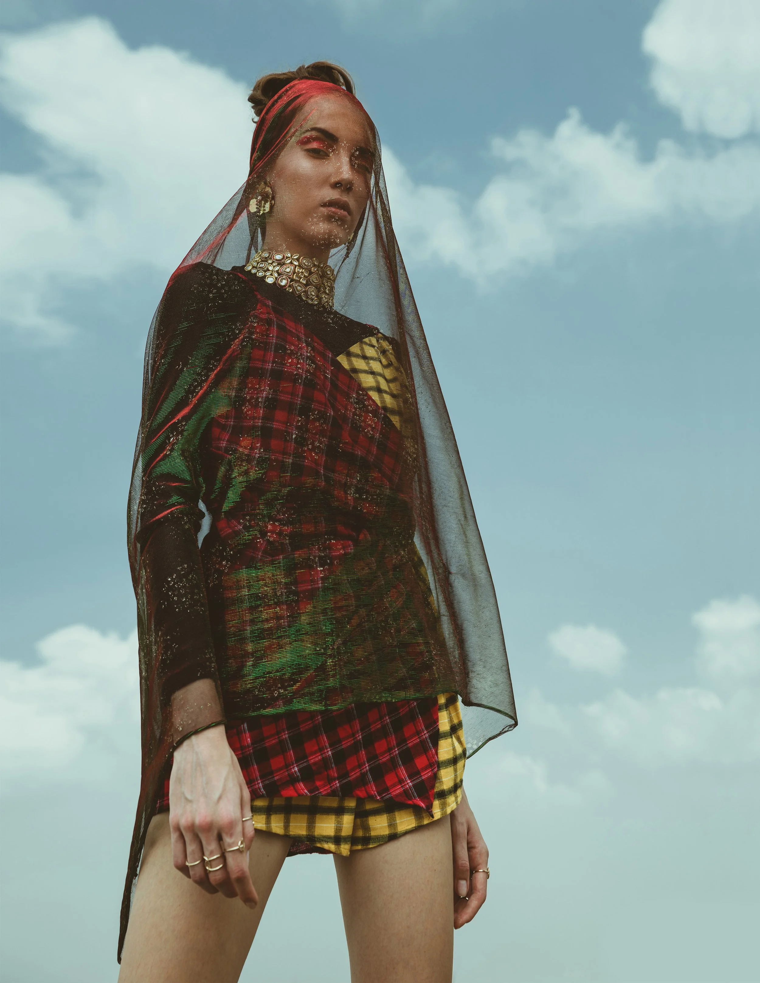  Wardrobe Credits:   Blue Faux Fur Jacket – H&amp;M  Footwear – Knotty Derby  White Tights – Selfridges &amp; co  Metallic Necklace - Topshop  Netted Mesh Top - Bianca Fyre  Headgear by Henna Parimoo 