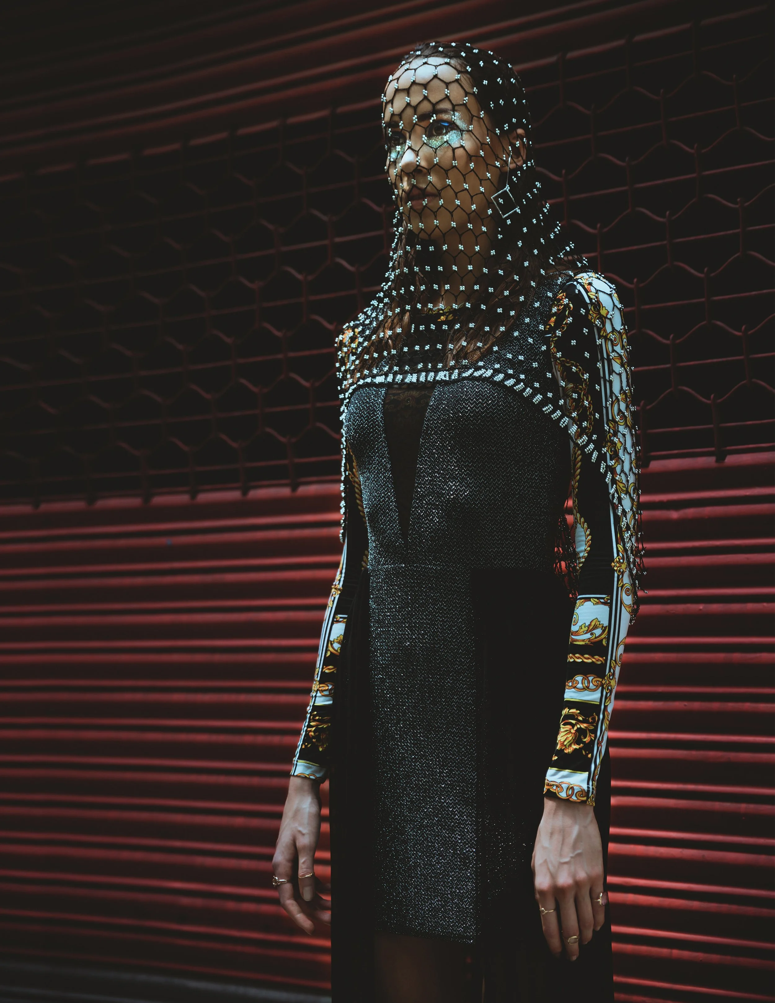  Wardrobe Credits:   Blue Faux Fur Jacket – H&amp;M  White Tights – Selfridges &amp; co  Metallic Necklace - Topshop  Netted Mesh Top - Bianca Fyre  Headgear by Henna Parimoo 