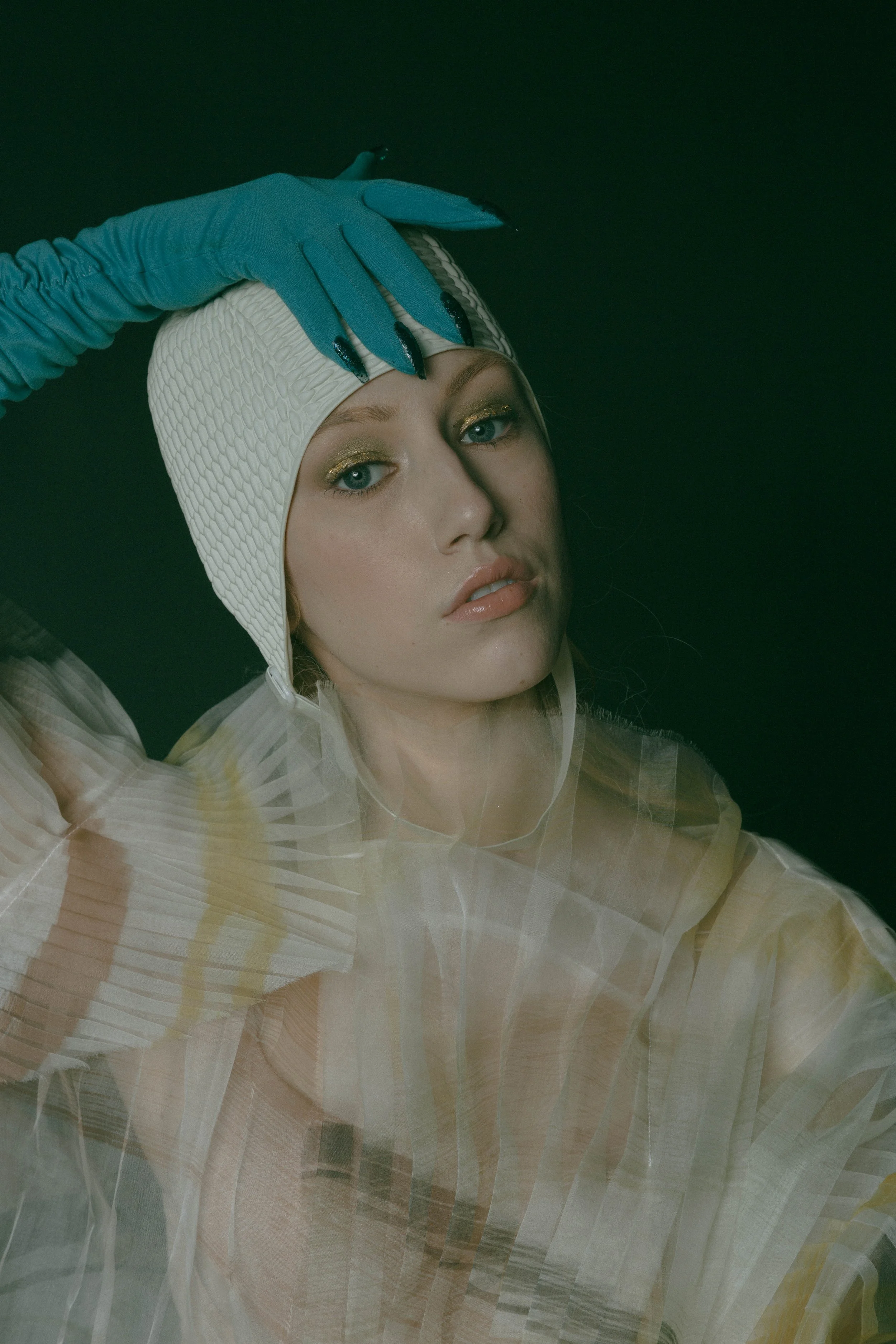  Wardrobe Credits:  Painted Asymmetric Pleated Blouse/ Shanshan Ruan Swim bathing cap/ Beemo Gloves/ Stylist own 