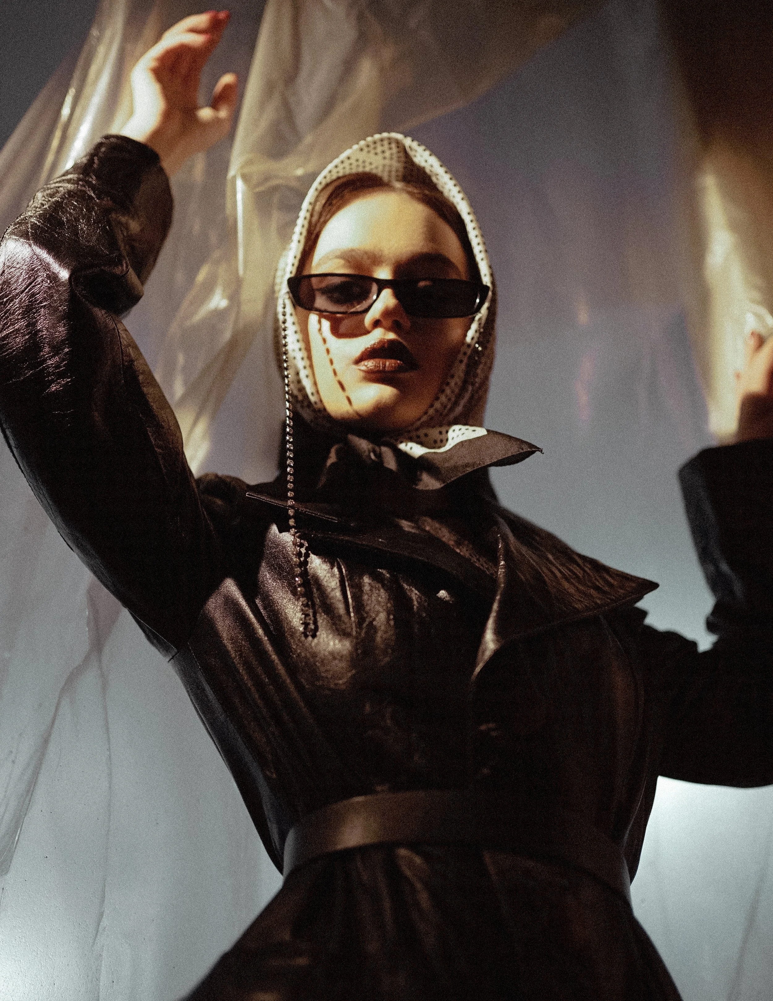  Wardrobe Credits: chain H&amp;M, leather coat Ibivio Pelle, glasses property stylist, neck scarf Vintage. 