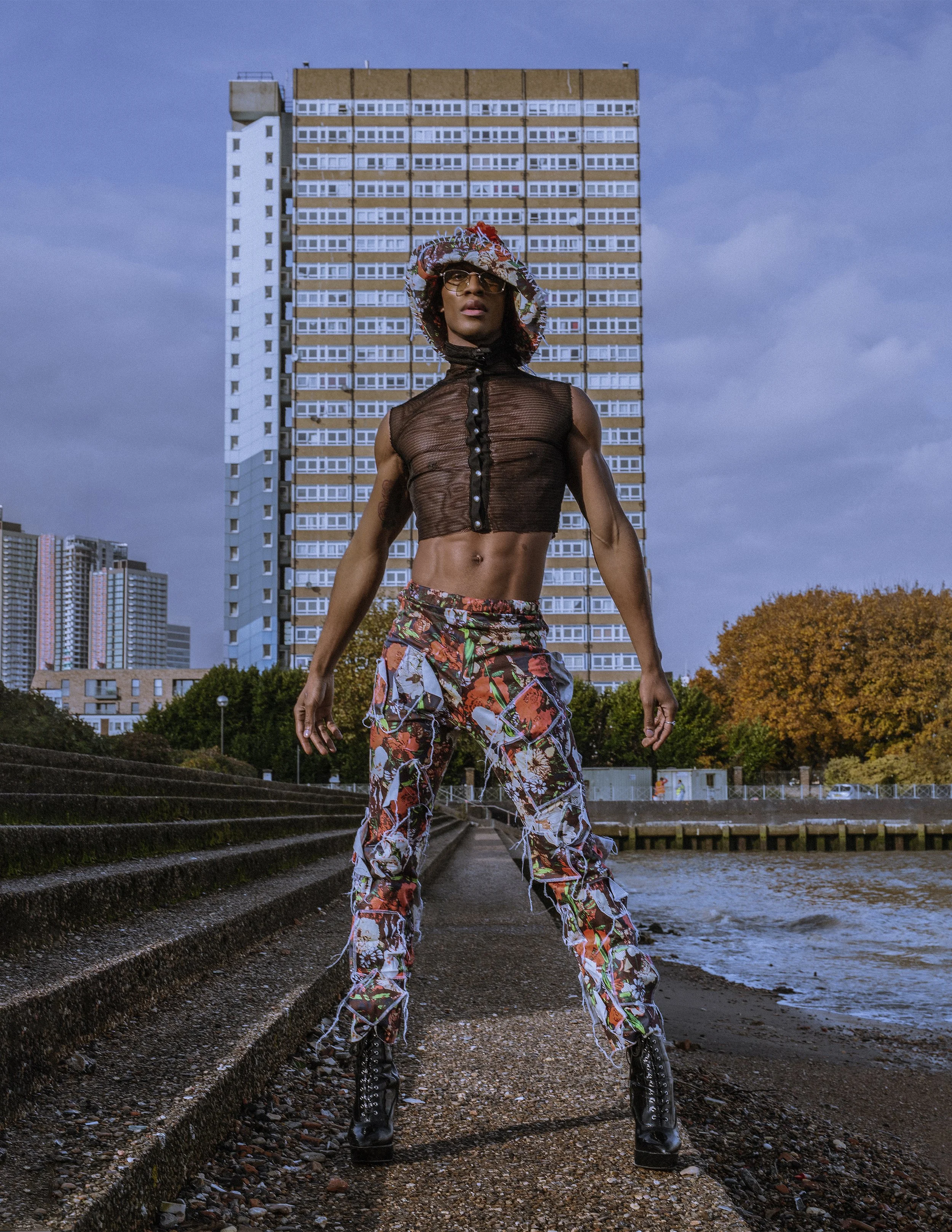  Photographer: James O'Doherty  Wardrobe Stylist/Creative Director: Monsieur Pariè  Model: Alexander Thomas @First Model Management    Wardrobe Credits:   Hat: Enni Lahderinne  Top: Maromas  Glasses: ASOS  Gloves: Zara  Pants: Liv Mains  Trainers: Ni