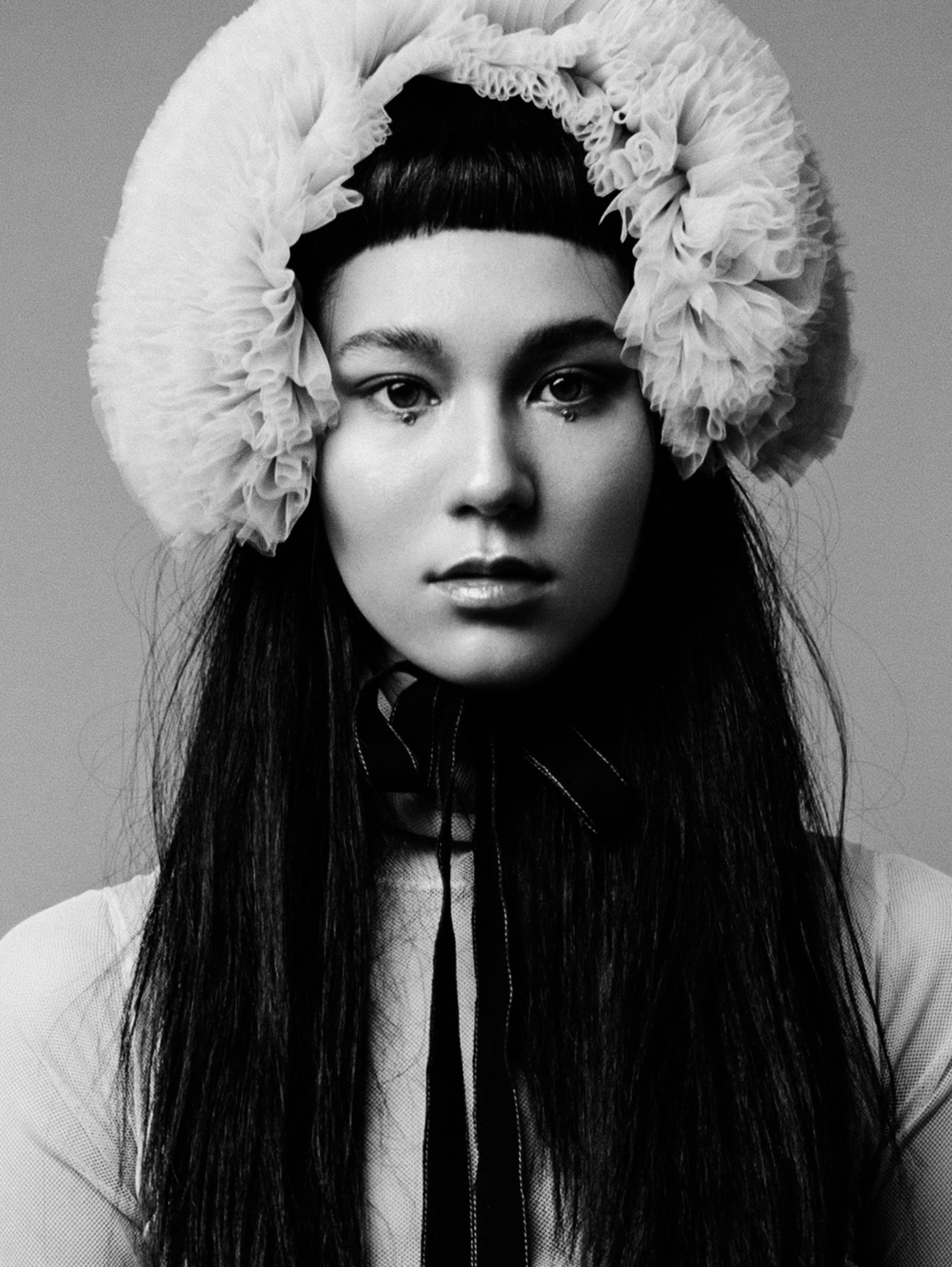  Wardrobe Credits  blue ruffled tulle hat with black bands 