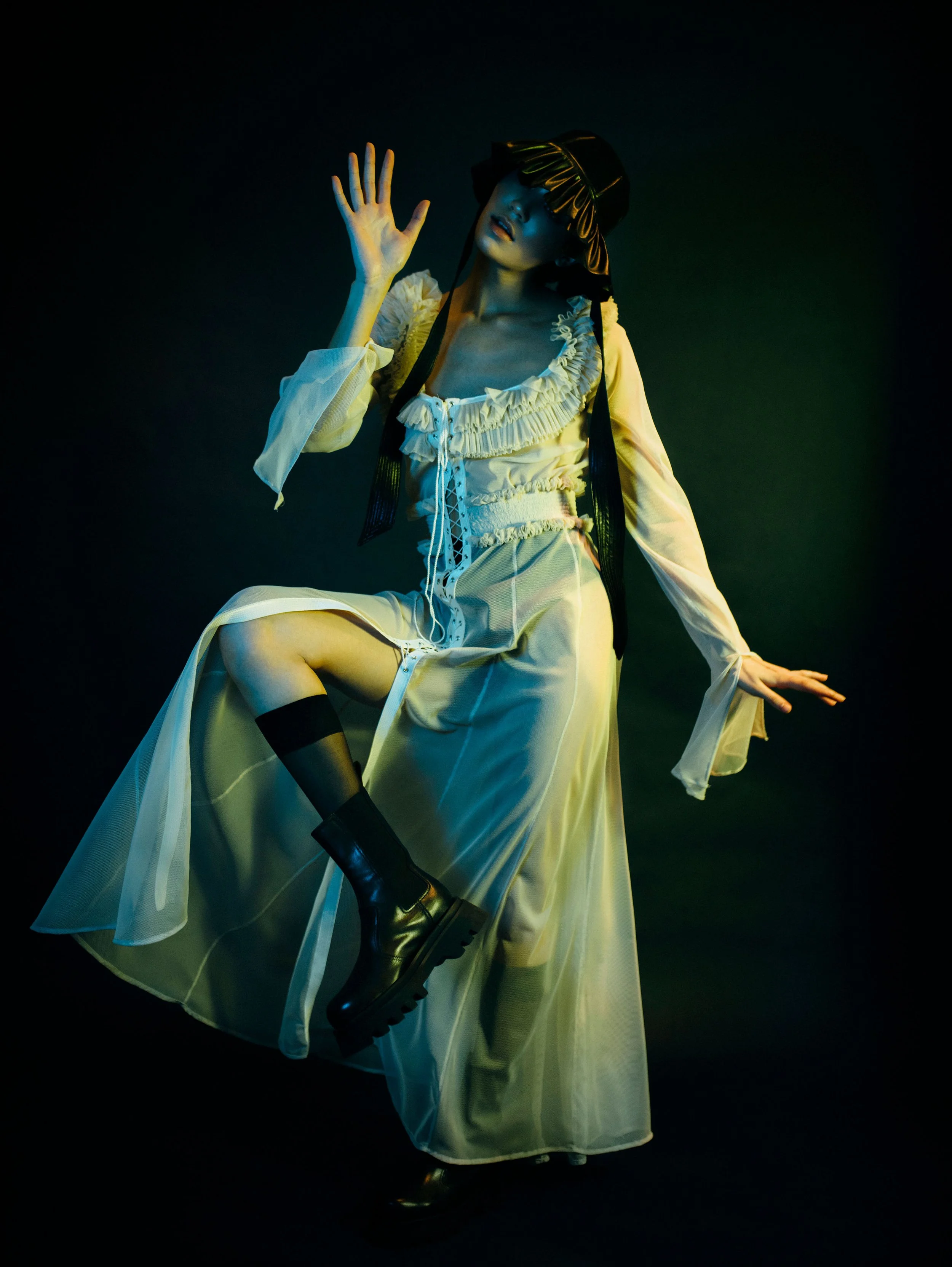  Designer  Jessica Walter  Photographer  dascha Ha  Model  Katharina Ritter  Makeup Artist  helenefunke  Agency  Faze Models Berlin    Wardrobe Credits  transparent mesh dress with corsage details and ruffled neckline  ruffled black bucket hat 