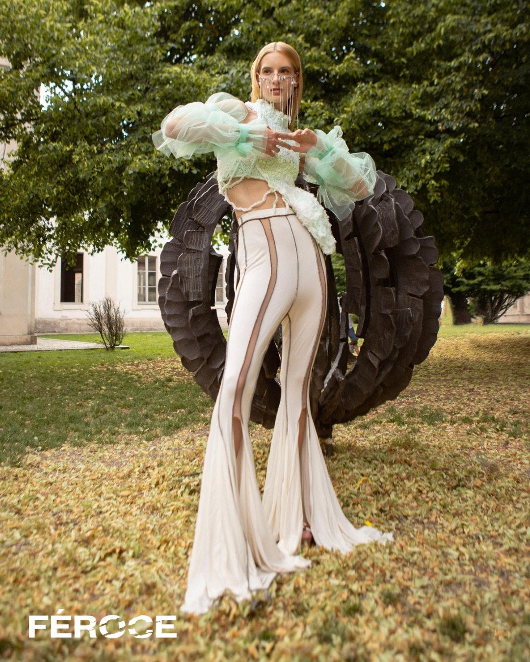  Photographer: Silvia Piva  Model: Livia Murvai  Makeup Artist: Francesca Rezzola  Wardrobe Stylist: Laura Maria Tonelli    Wardrobe:  Top: Tooca    Sleeves: Artificial Maria    Trousers: Mayra Salierno    Face piece: Martina Vega    Shoes: Simon Cra