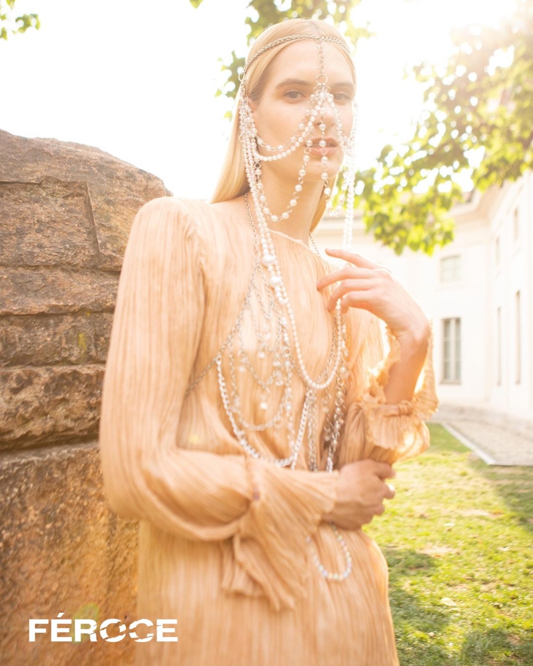  Photographer: Silvia Piva  Model: Livia Murvai  Makeup Artist: Francesca Rezzola  Wardrobe Stylist: Laura Maria Tonelli    Wardrobe:  Dress:  Ar.Ma.Cre.Se ‍  ‍  Skirt: Patrizia Pepe    Head piece: Martina Vega    Chain bra: Martina Vega 