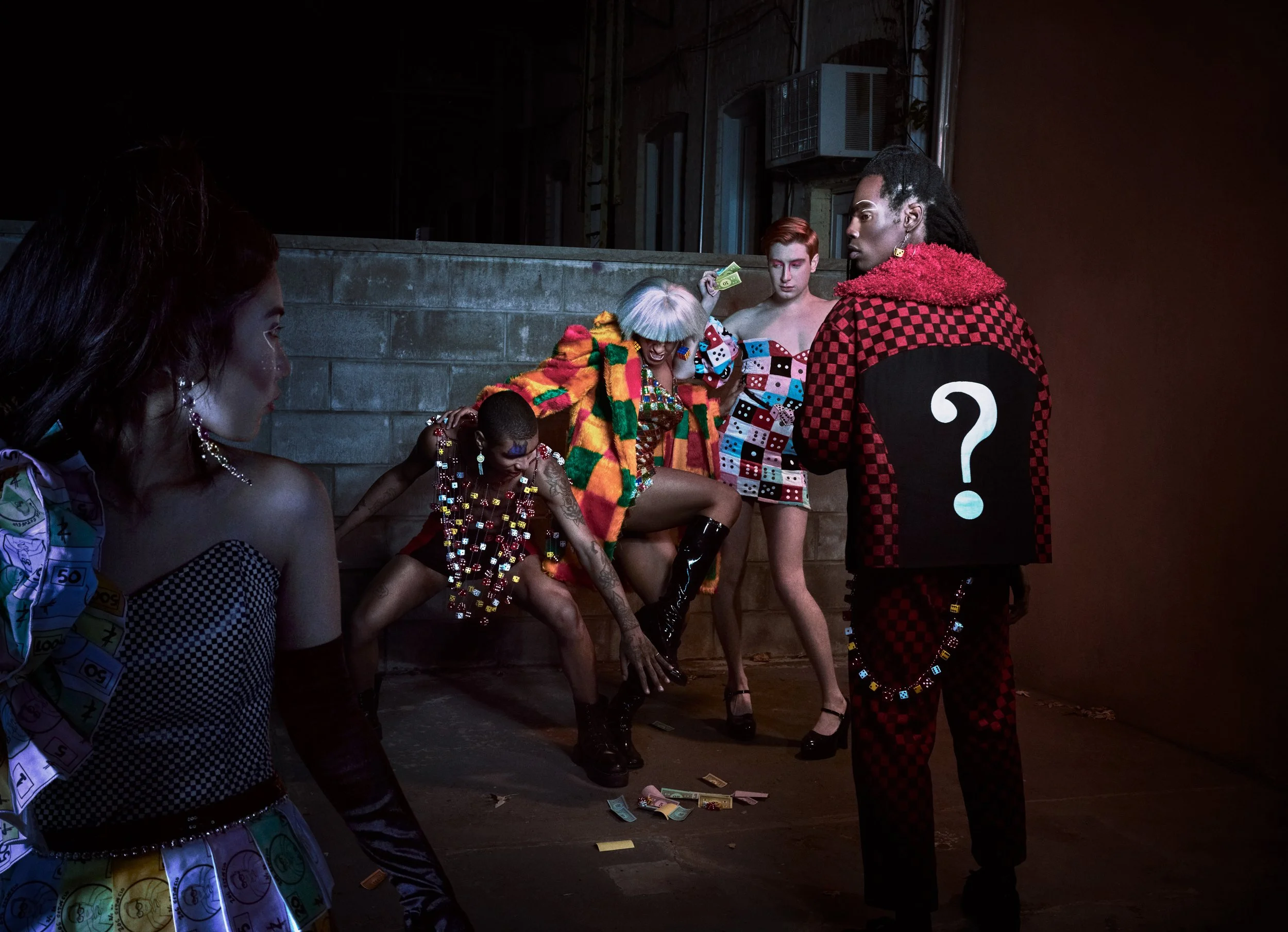  Photographer: Steven Warren    Model: Eric Ellison  Checker corduroy question mark jacket, checker corduroy pants with dice chain    Model: Dash Katz  Deconstructed fuzzy dice dress with puff sleeve    Model: Tommy Playboy  Dice chain top, color blo