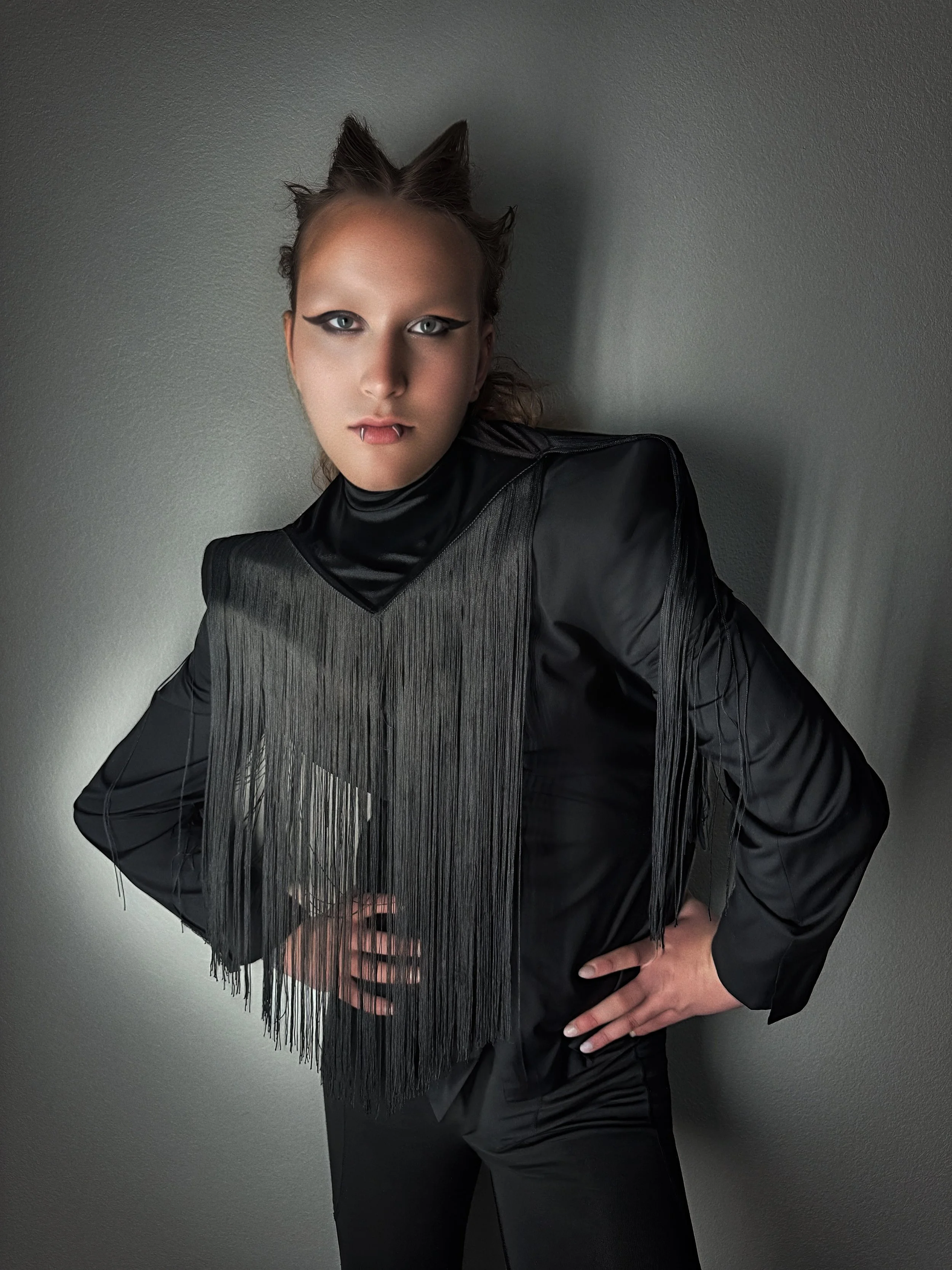   Jacket &amp; Trousers: Calvin Klein     Collar: Black Tulip Antiques Fashion Archive  