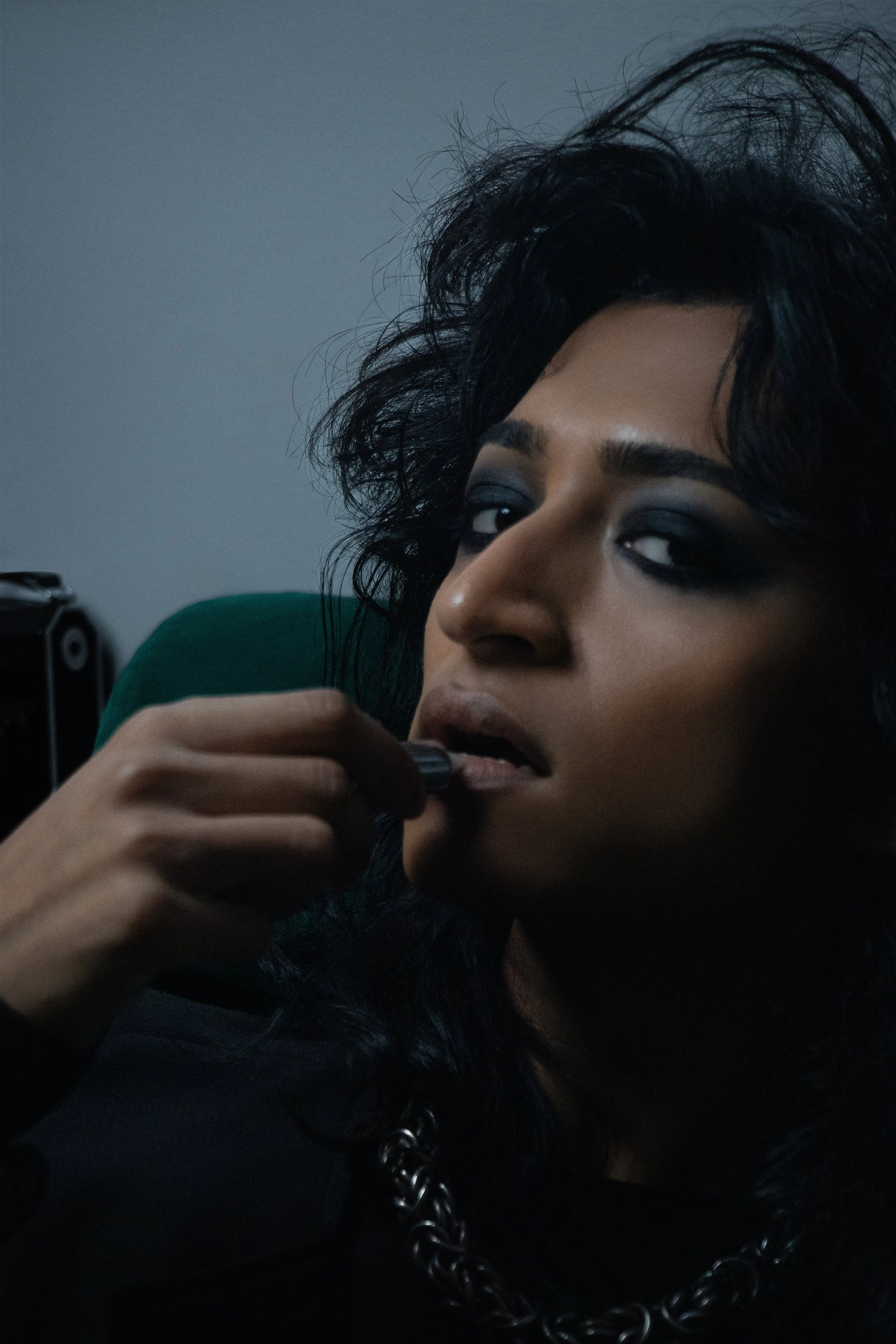 Smoked-out eyes and messy volume bring raw sensuality to the frame