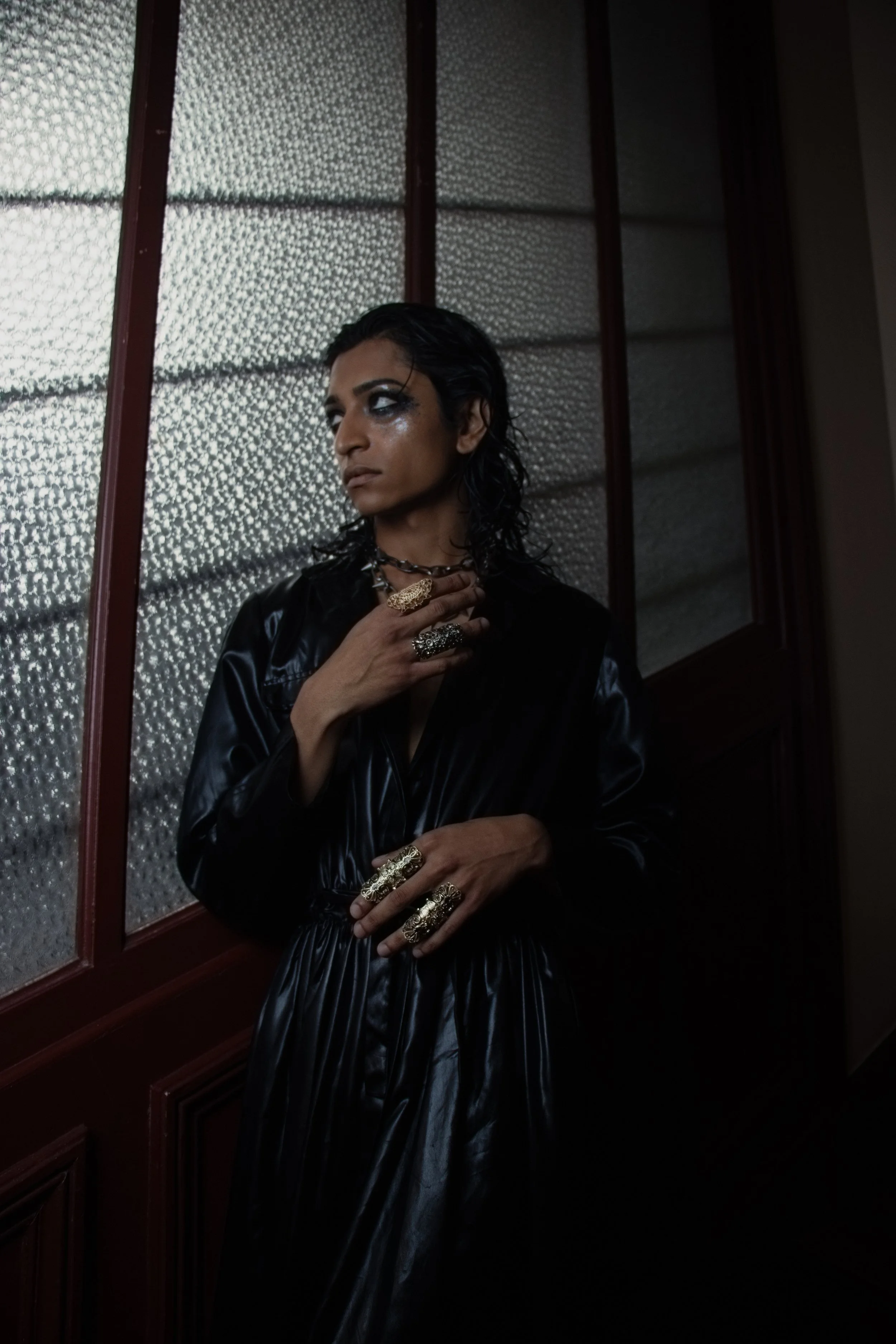  Statement jewelry and glossy textures bring a rebellious elegance to the frame
