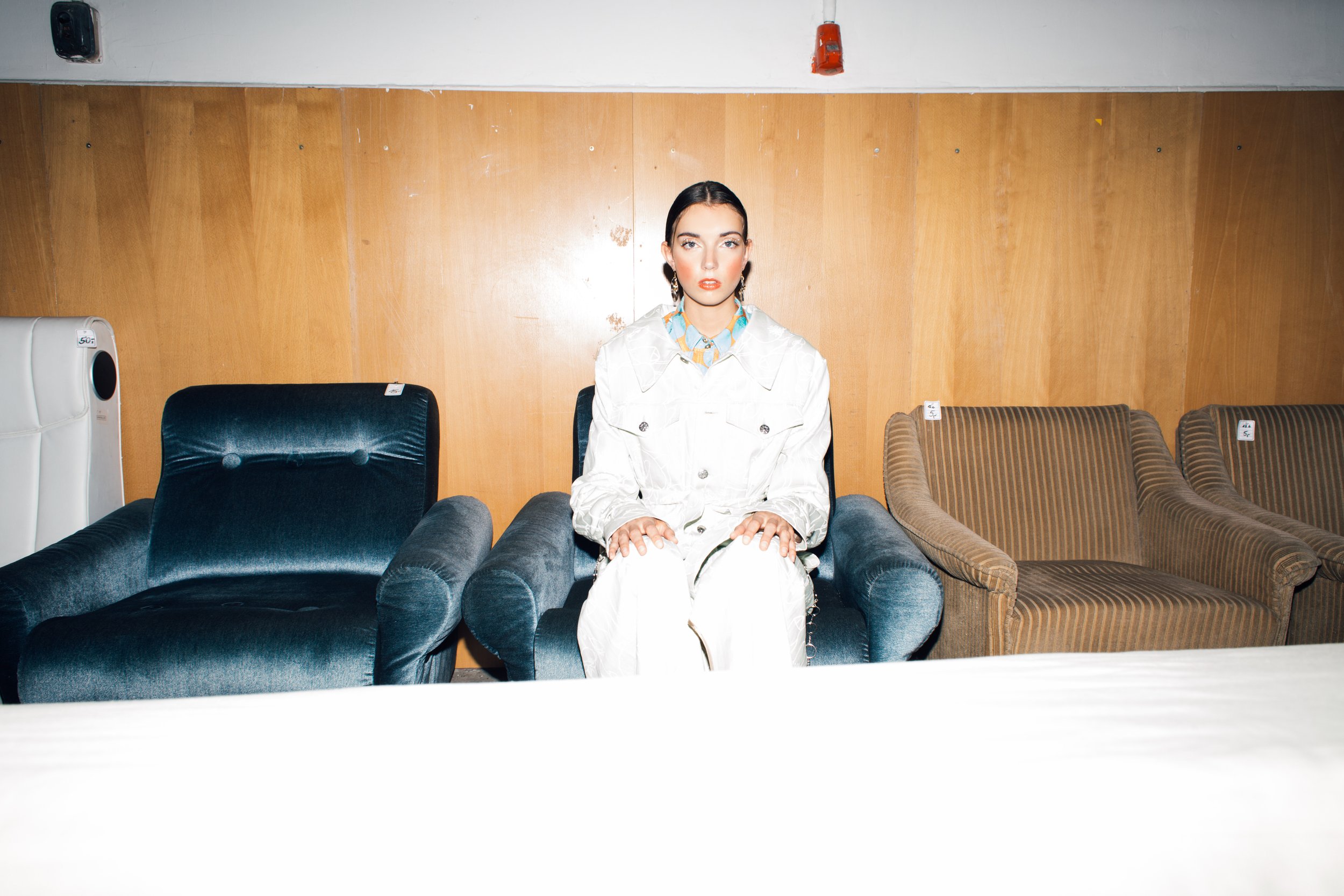   Wardrobe Credits    Angelina: Coat: Vanessa Schreiner     Blouse: Narbon     Earrings: H&amp;M  