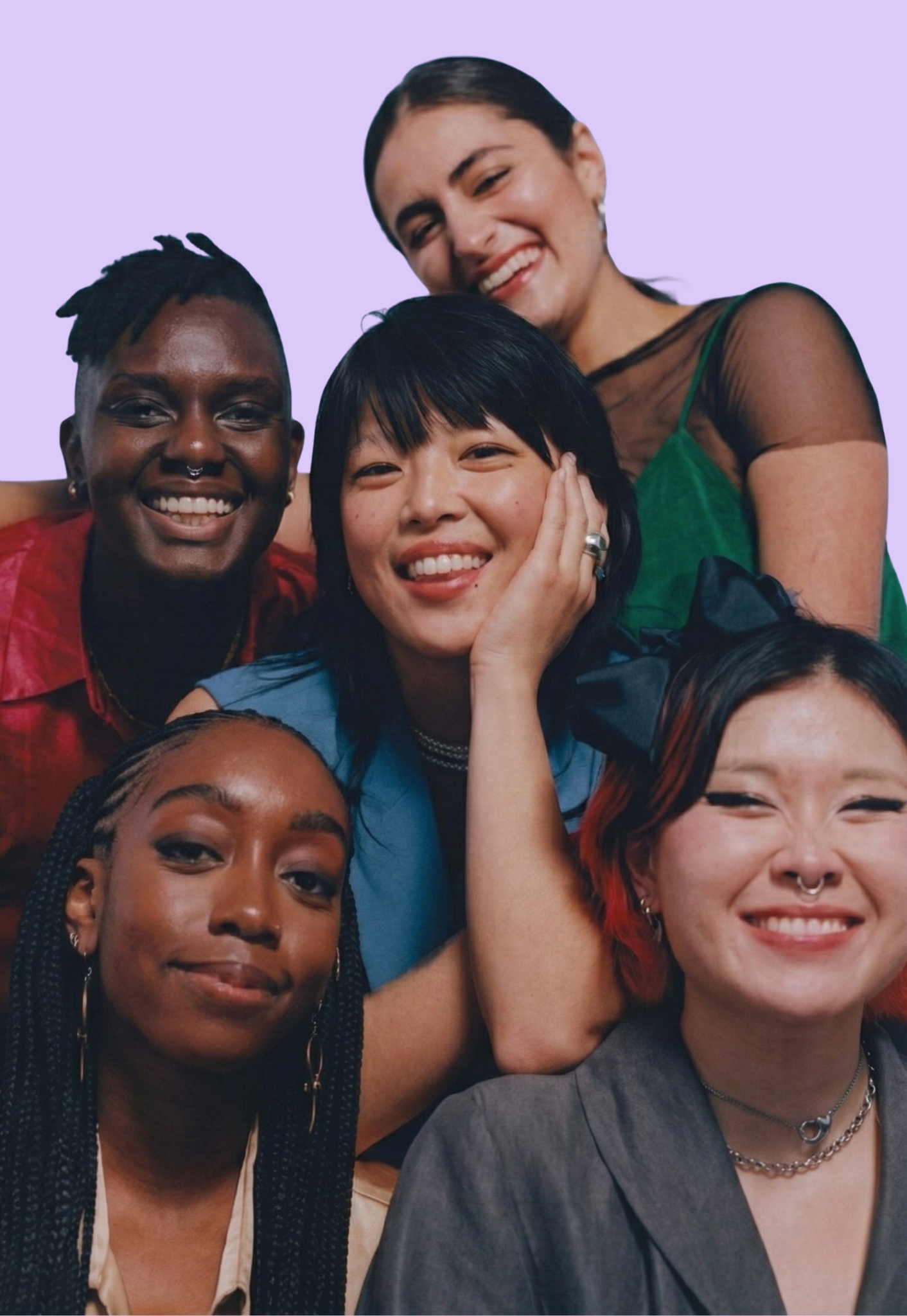 Group of six diverse smiling women posing together against a light purple background.