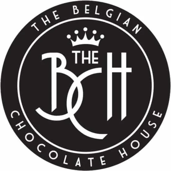 Black circular logo with the text 'The Belgian Chocolate House' around the outside and a crown above the stylized initials 'BH' in the center.