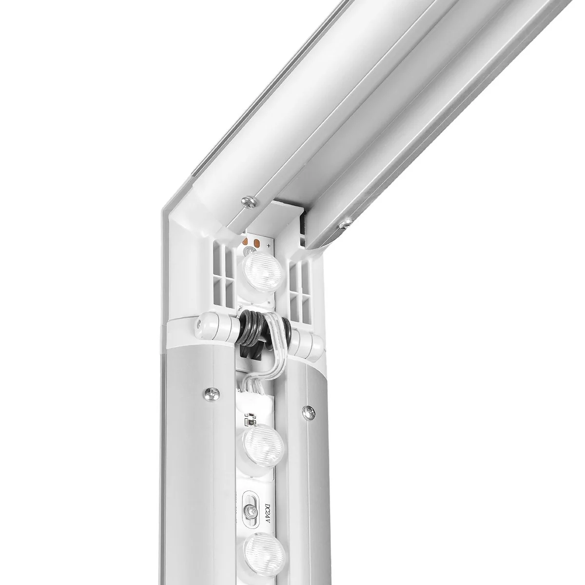 Close-up of a section of a white and silver LED lighting fixture with multiple bulbs and a metal track system.