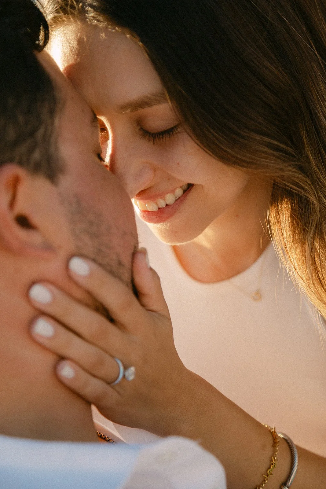 Couple kisses after a marriage proposal in Menorca.jpg