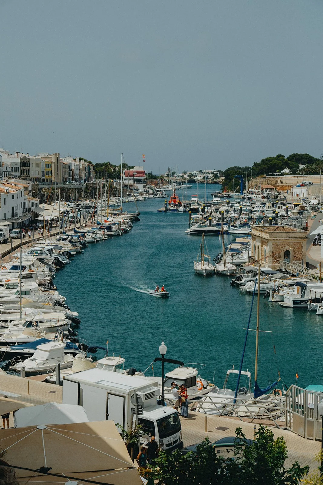 A boat is entering Ciutadella's port
